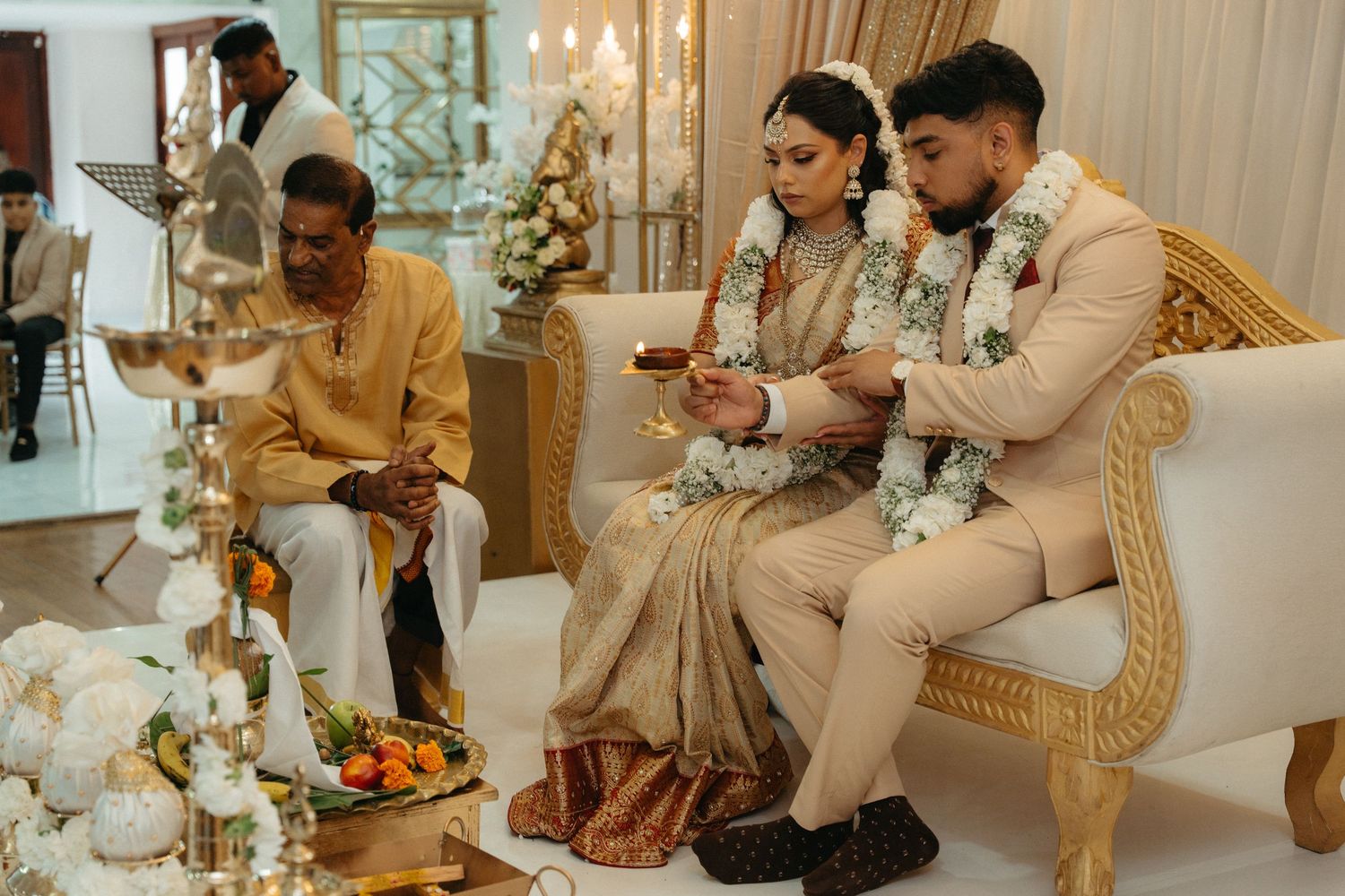 A collage of elegant wedding reception photos showing a couple dining and celebrating at a luxurious venue with gold decor.