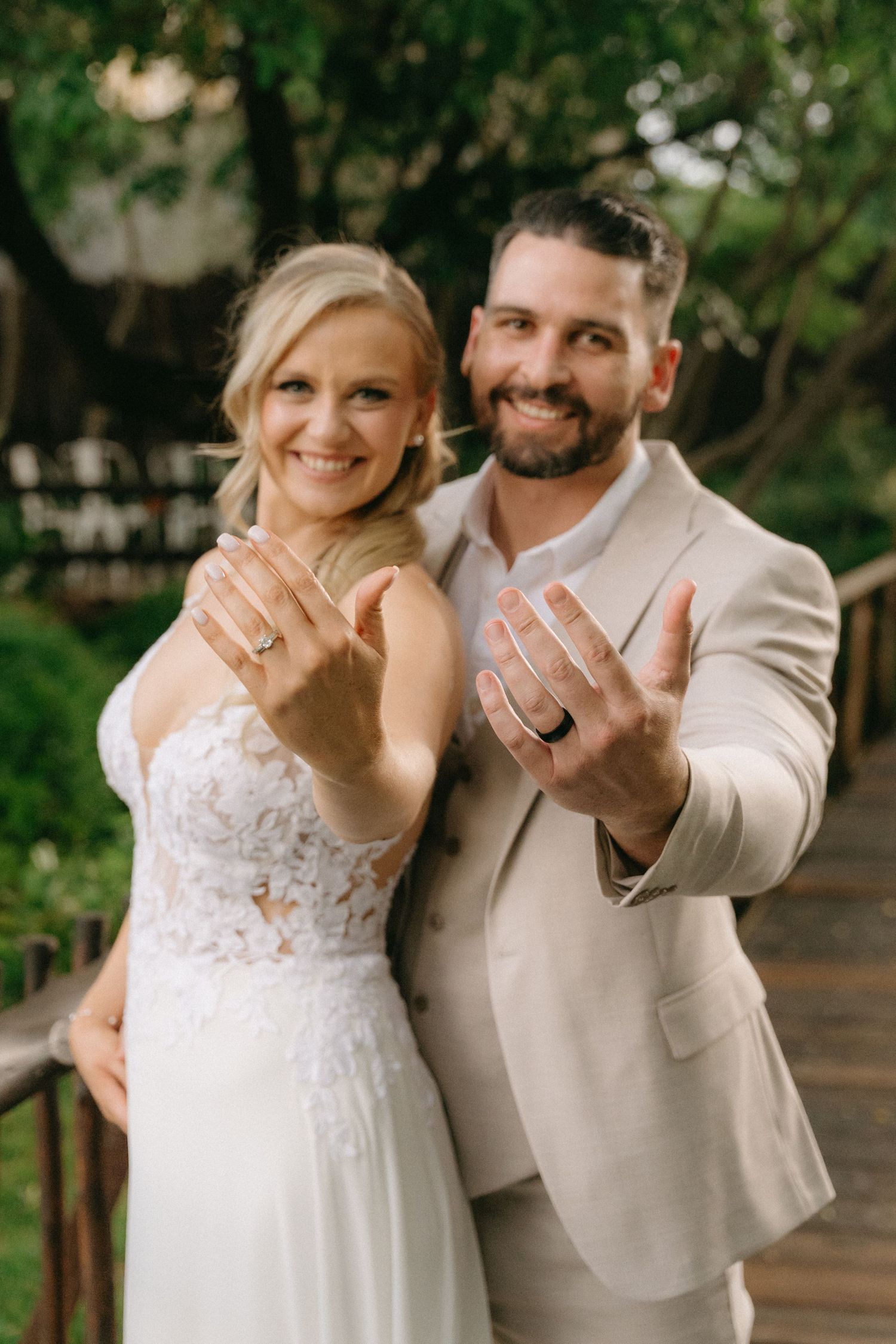 Newlyweds show off their wedding rings in series of candid outdoor photos.