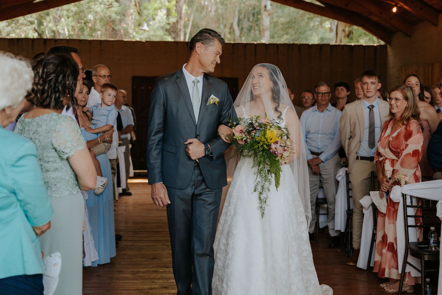 Dad and bride share a smile as he walks her down the aisle, @Boshoek weddings