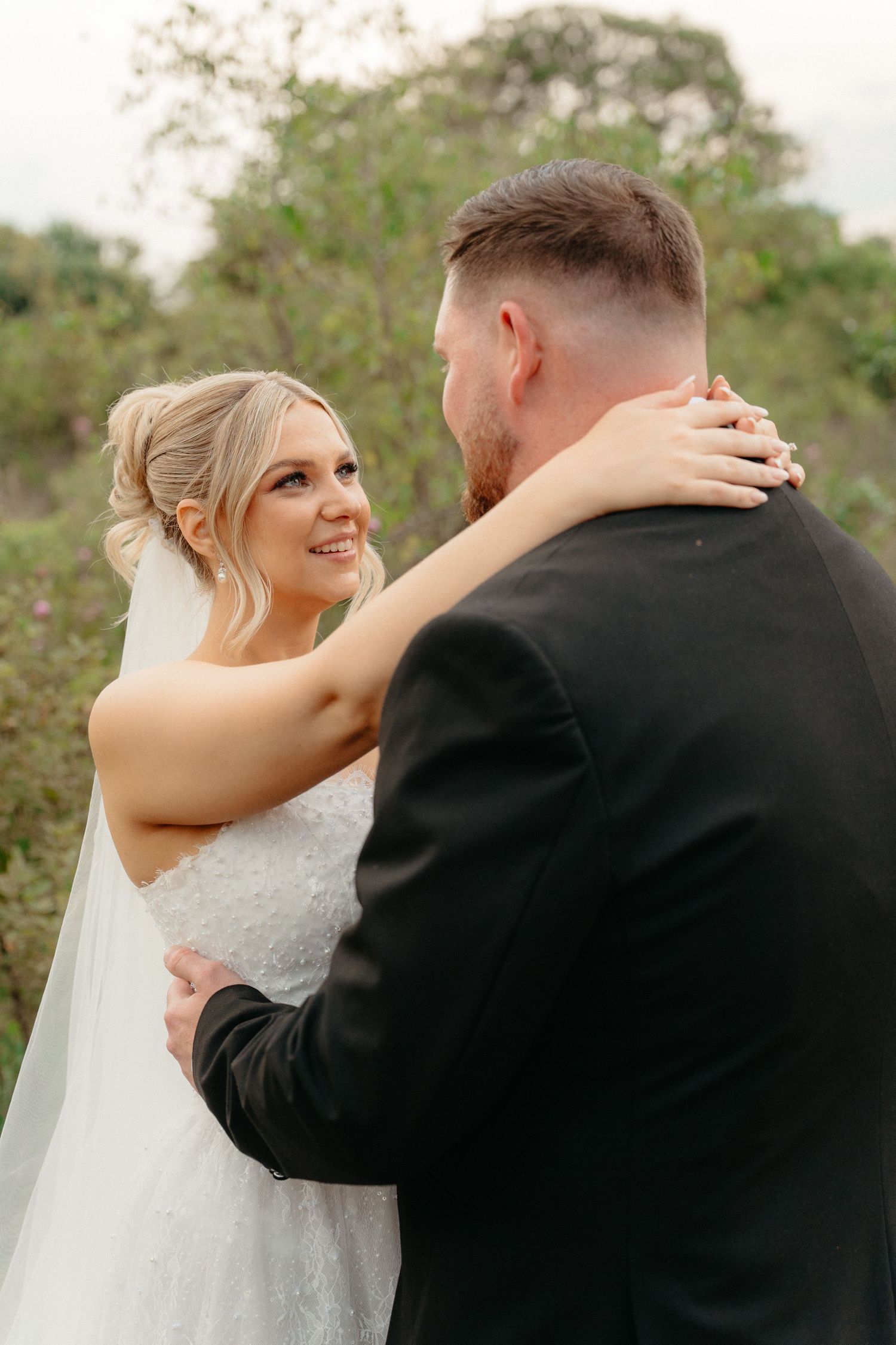 A romantic wedding moment captured in three sequential photos showing a couple embracing outdoors in natural lighting.