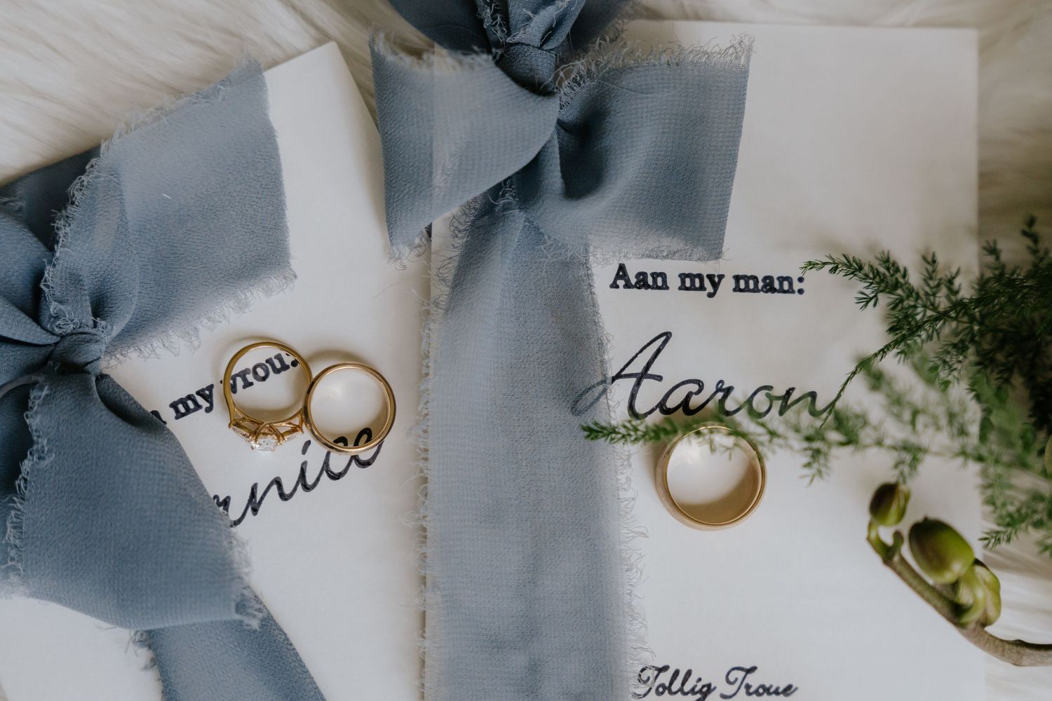 Elegant wedding invitation cards with handwritten calligraphy and coffee stain details arranged in a row.