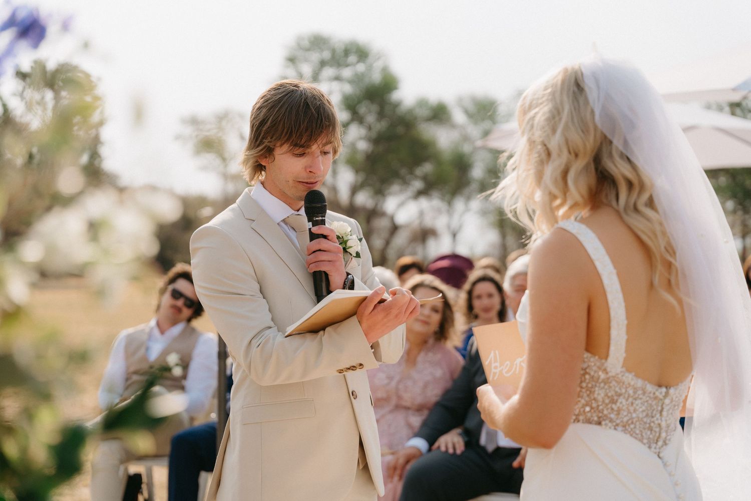 Candid moments from outdoor wedding ceremony with natural lighting.