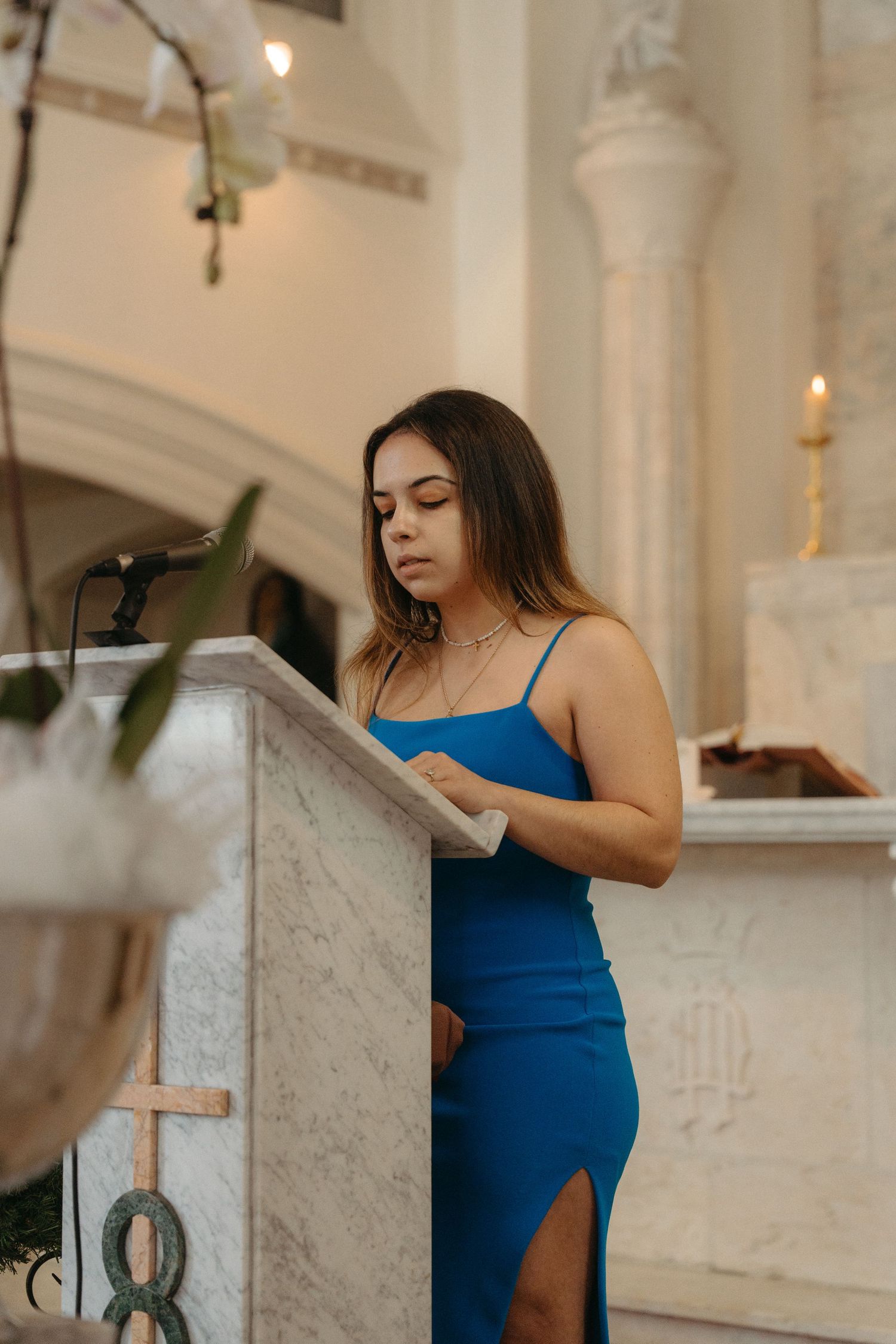 A woman in a blue dress does a reading during a Catholic wedding ceremony at Nazareth House Chapel in Pretoria