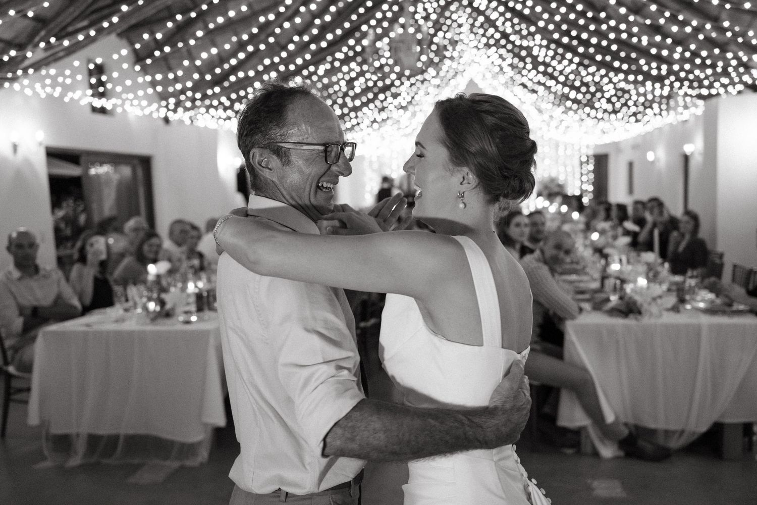 A series of four wedding reception photos showing couples dancing and celebrating under decorative string lights.