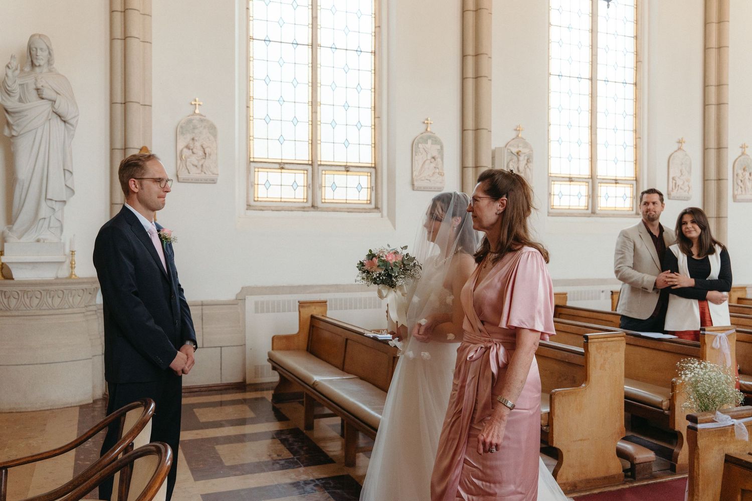 A couple shares a joyful moment during their wedding ceremony in a bright, elegant church interior at Nazareth House, Pretoria