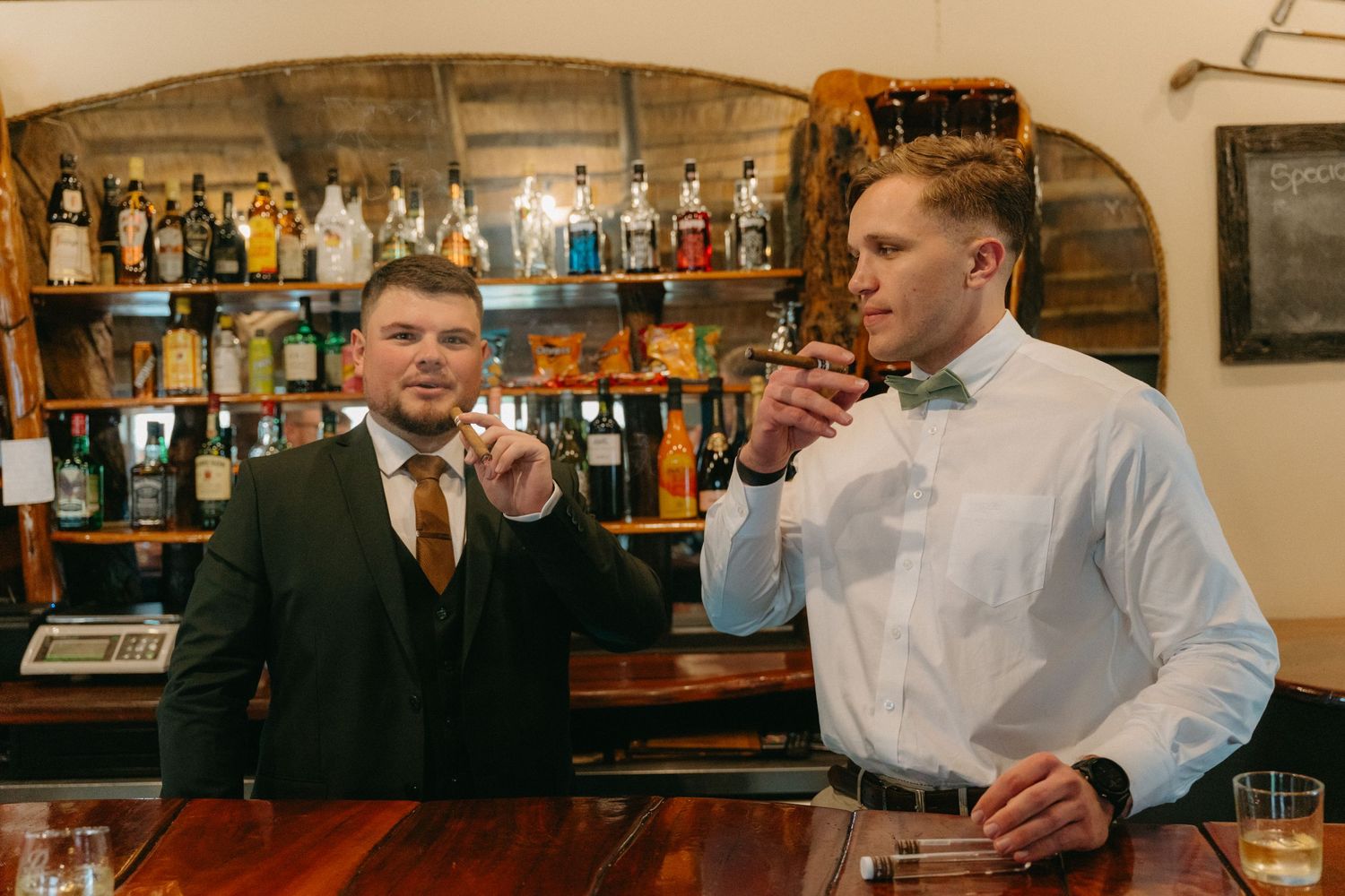 Interior shots of a rustic bar setting with wooden details and bottle displays.