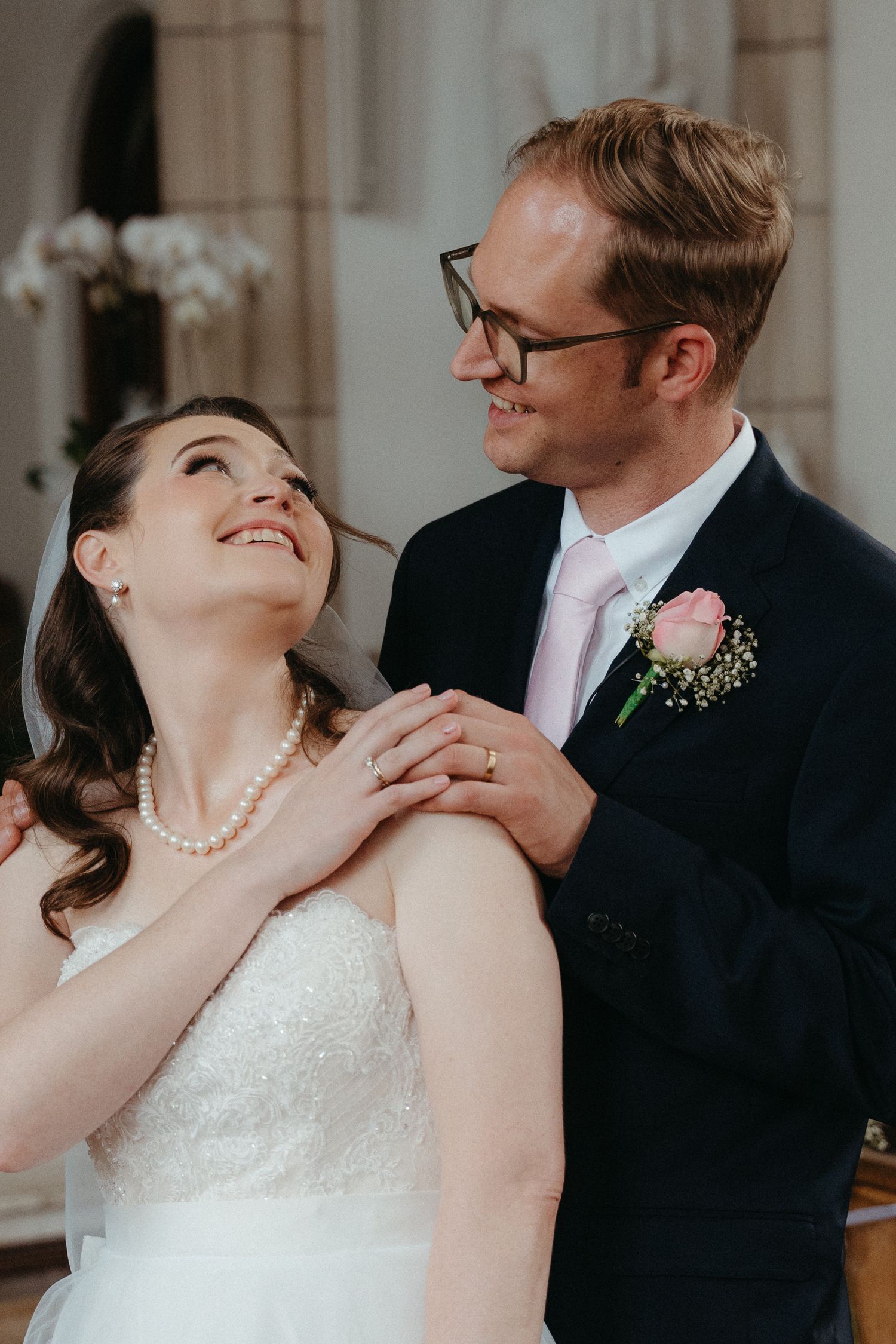 A romantic sequence of wedding photos showing tender moments between a bride in white and groom in dark suit.