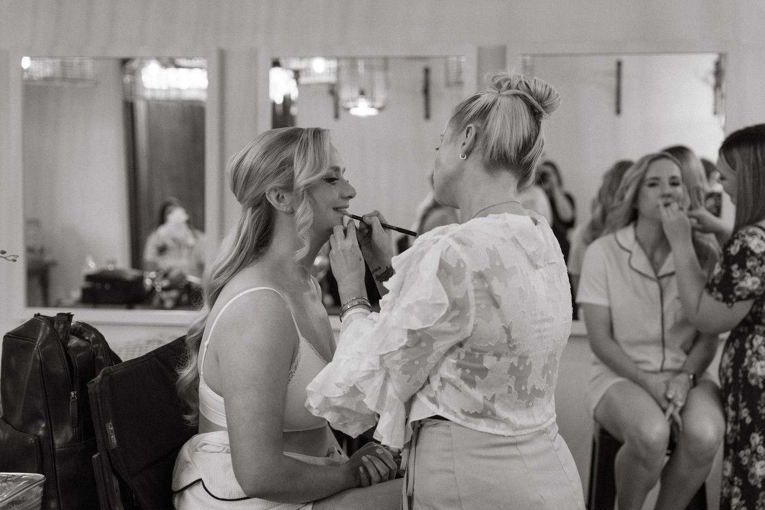 Black and white candid shots of wedding guests during reception.