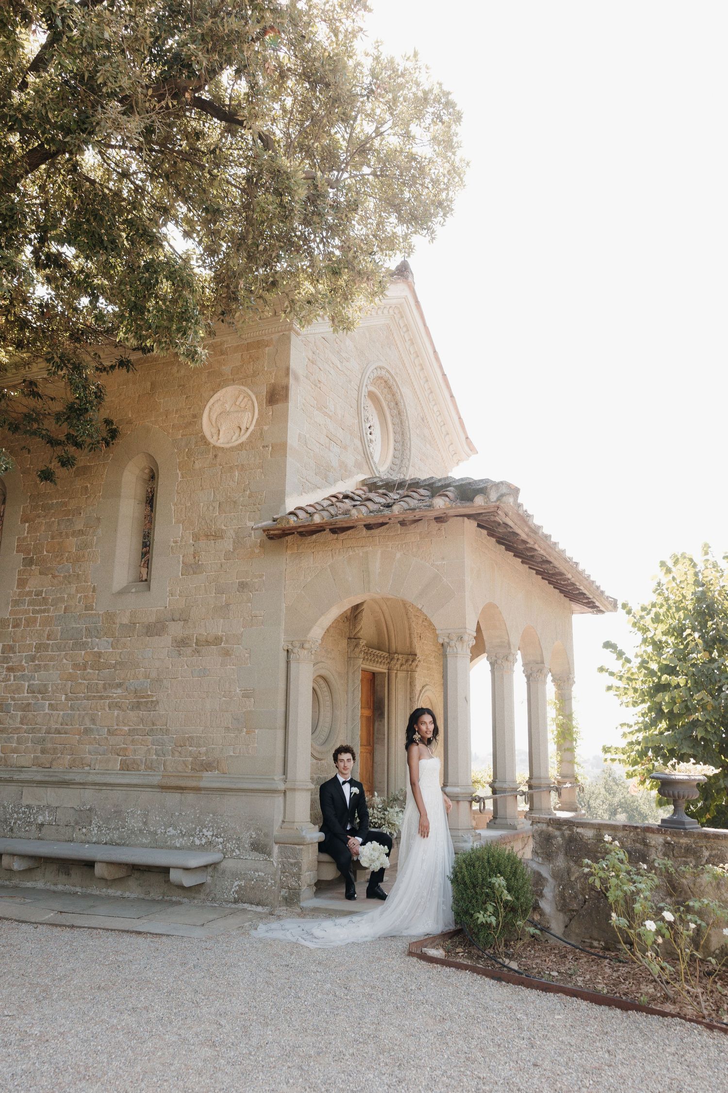 Sunlit bride and groom portrait by destination wedding photographer Maryna Cherednikova