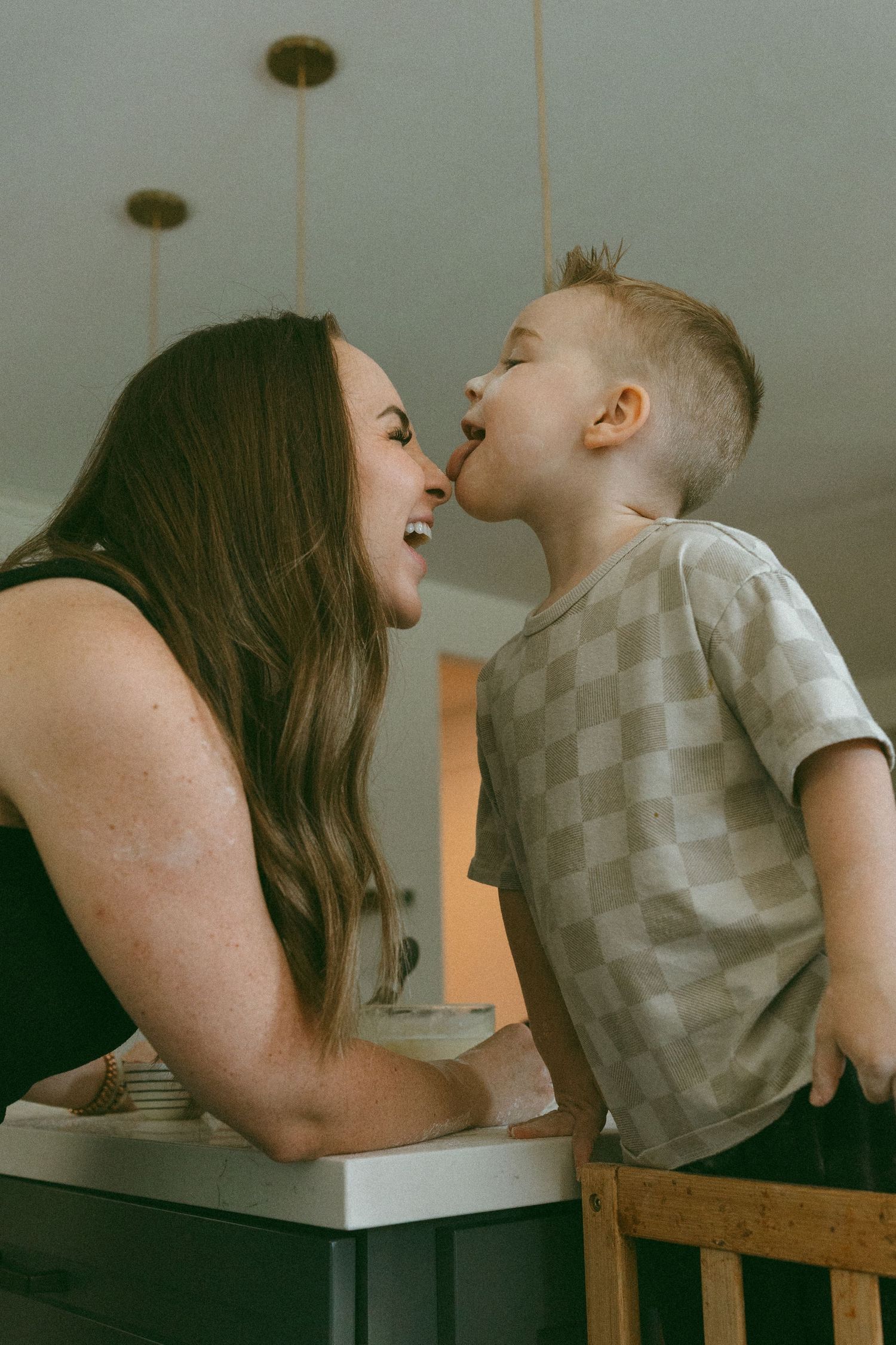 Mom and son playing during a baking session in a lifestyle photo session
