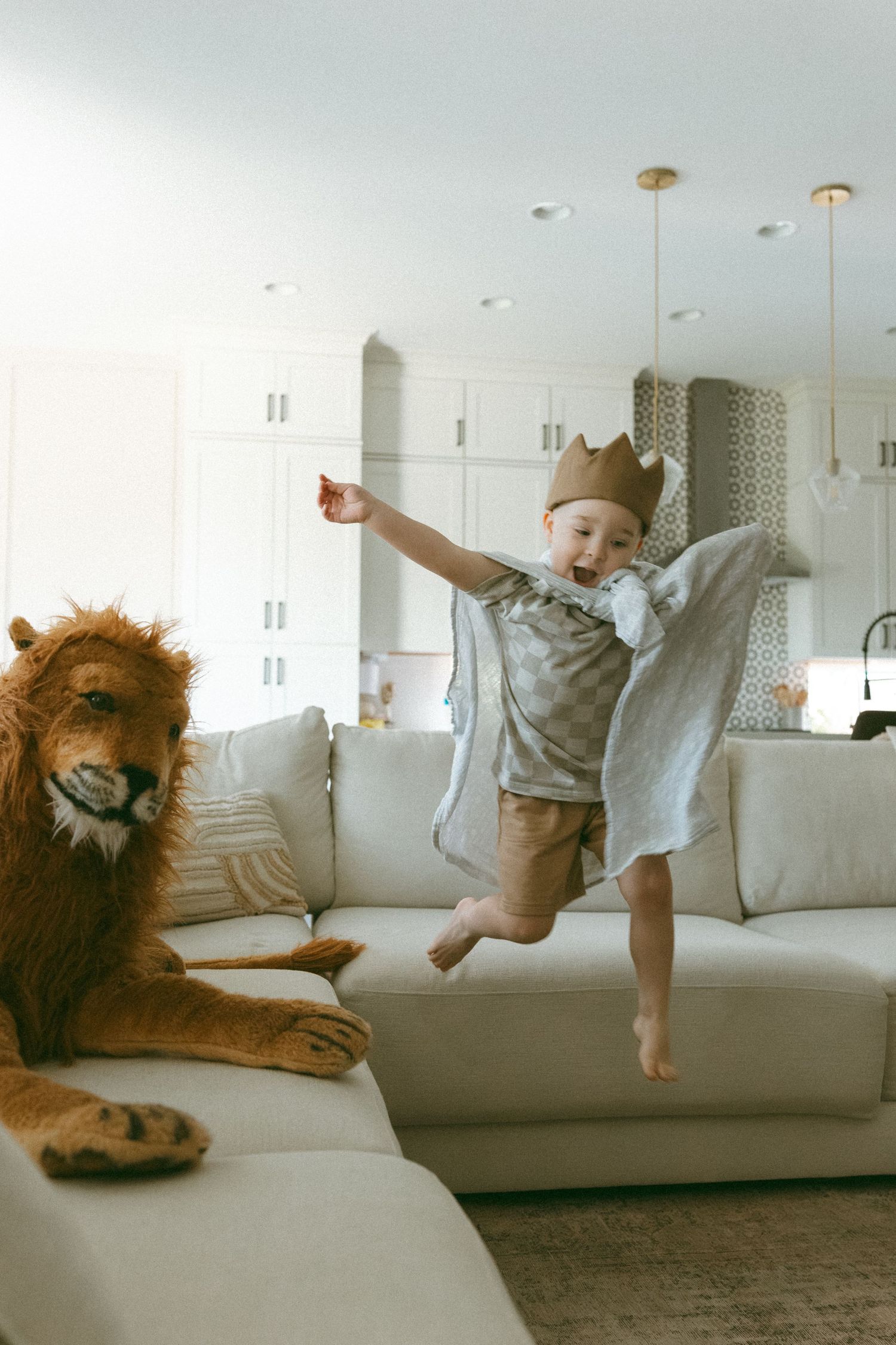Toddler playing make believe during a lifestyle session