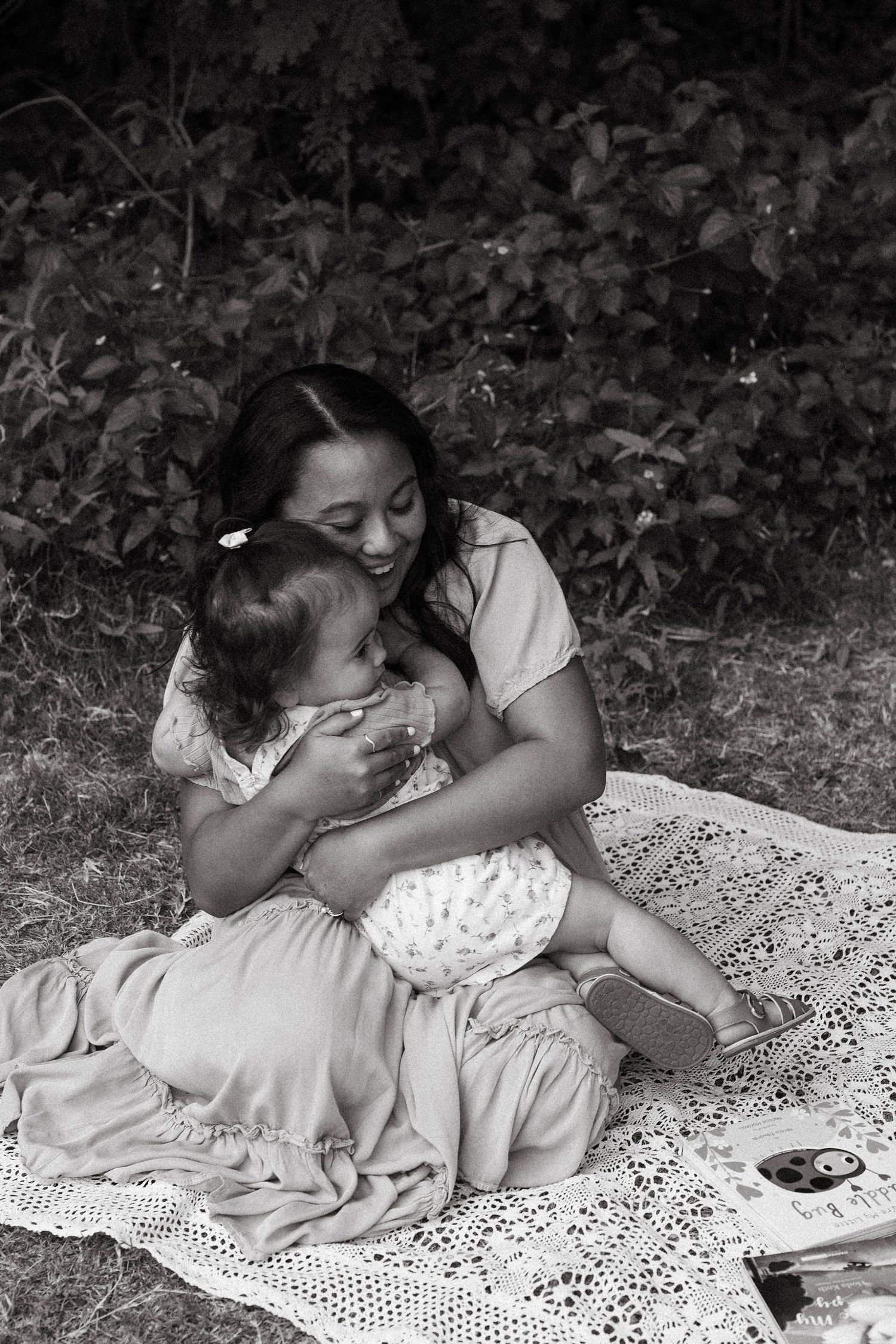 Mother embracing her daughter in an Arizona meadow