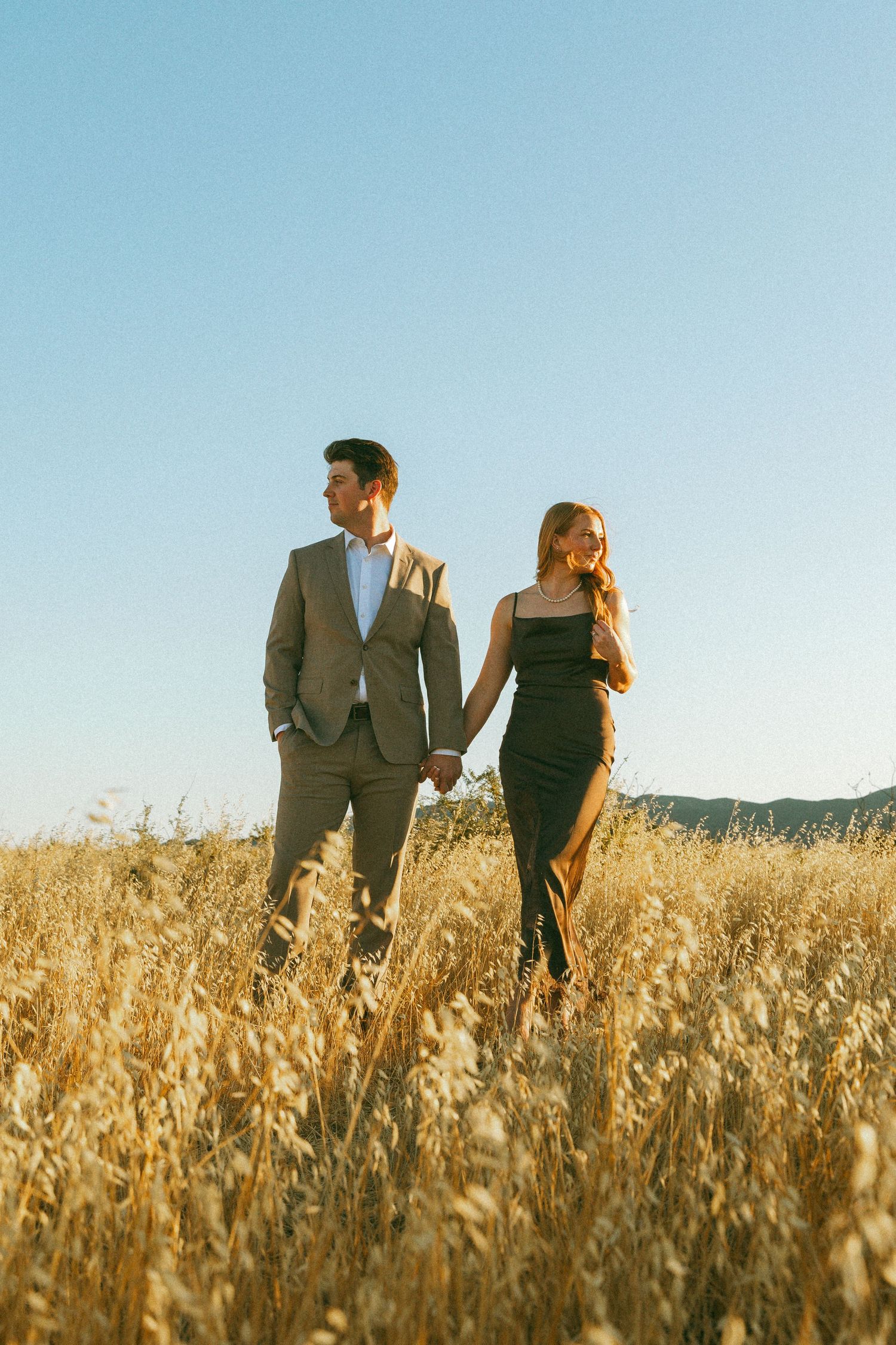 Couple standing in a wheat field