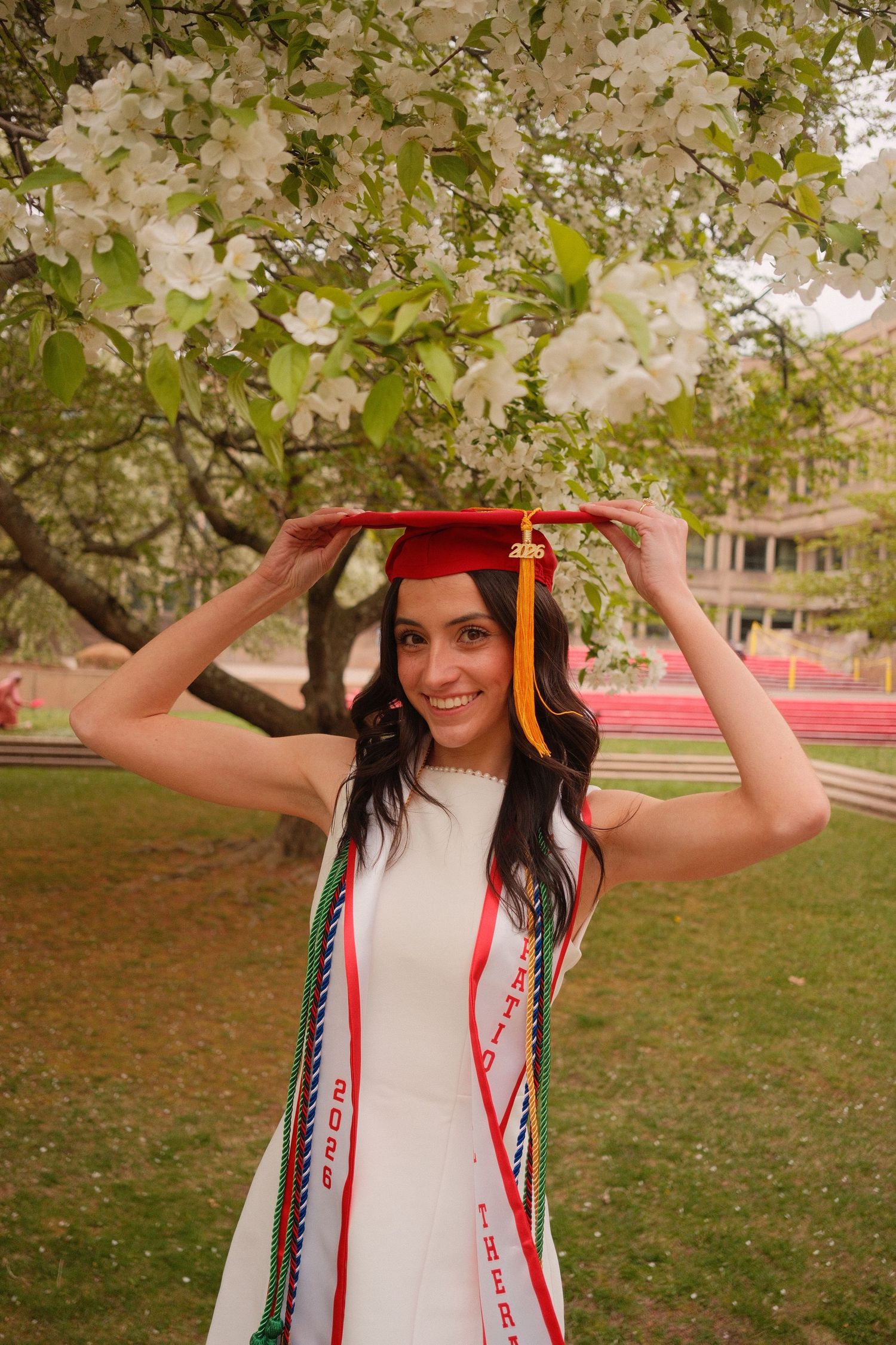 Graduate smiling during a candid graduation portrait session.