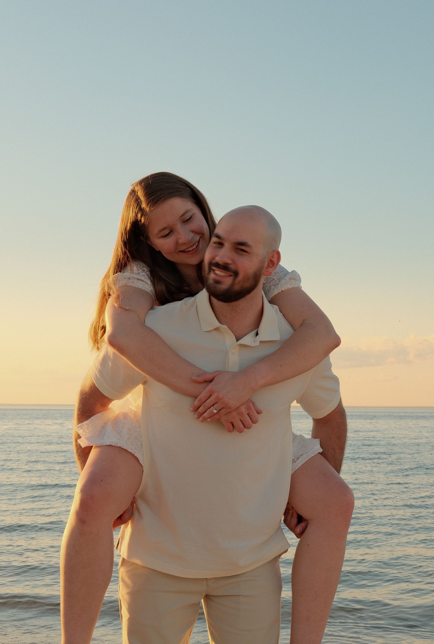 Close-up engagement portrait focusing on natural emotion and connection.