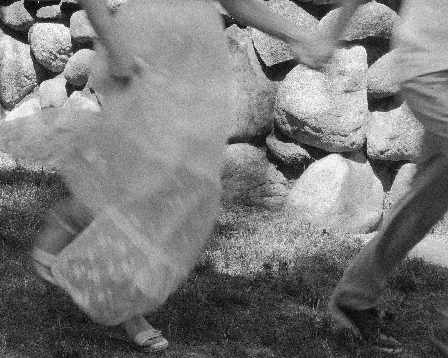 Film-inspired engagement photo with intentional motion blur capturing movement and emotion.