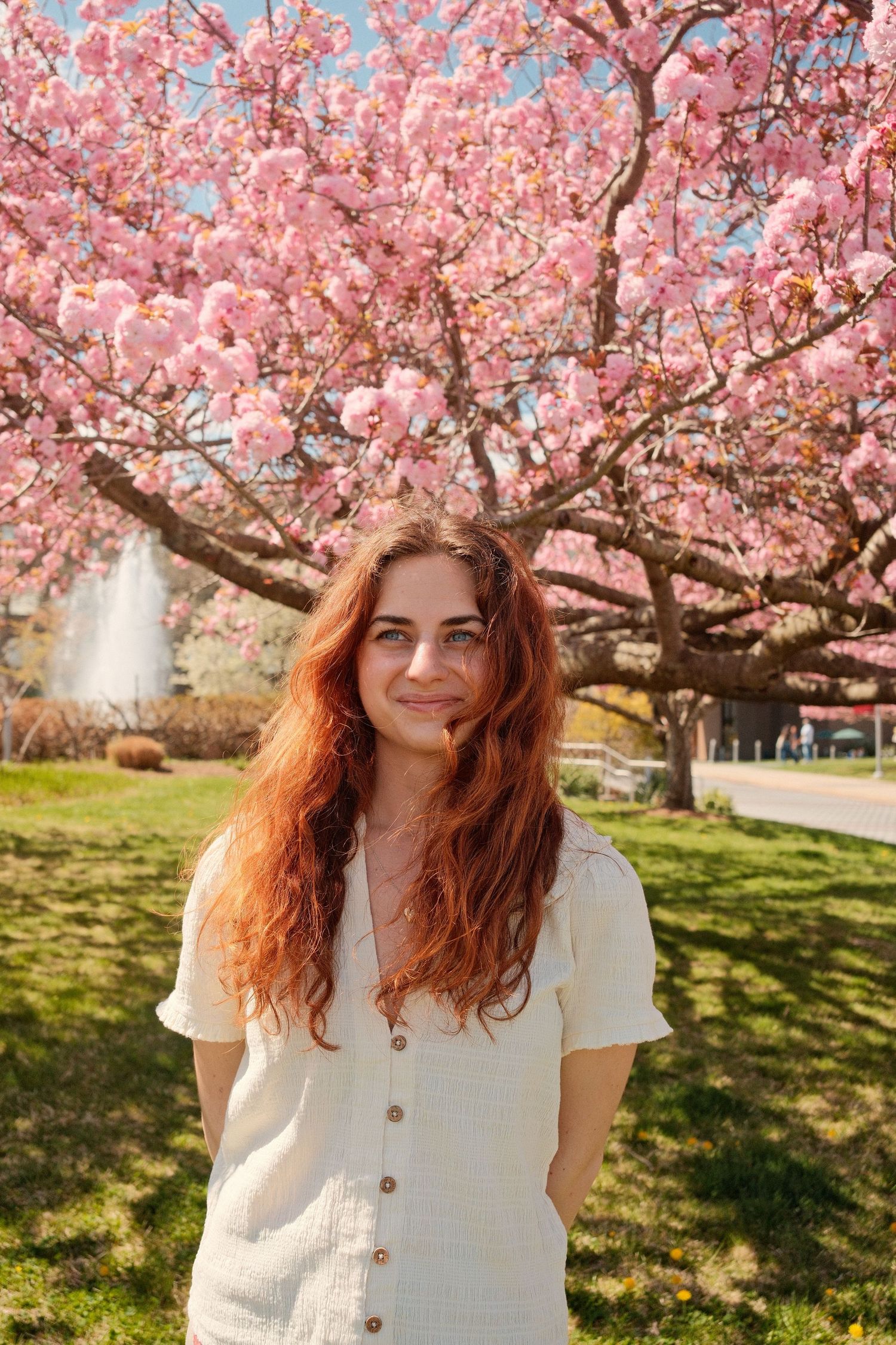 Portrait of Marissa, a Long Island photographer, captured in natural light outdoors.