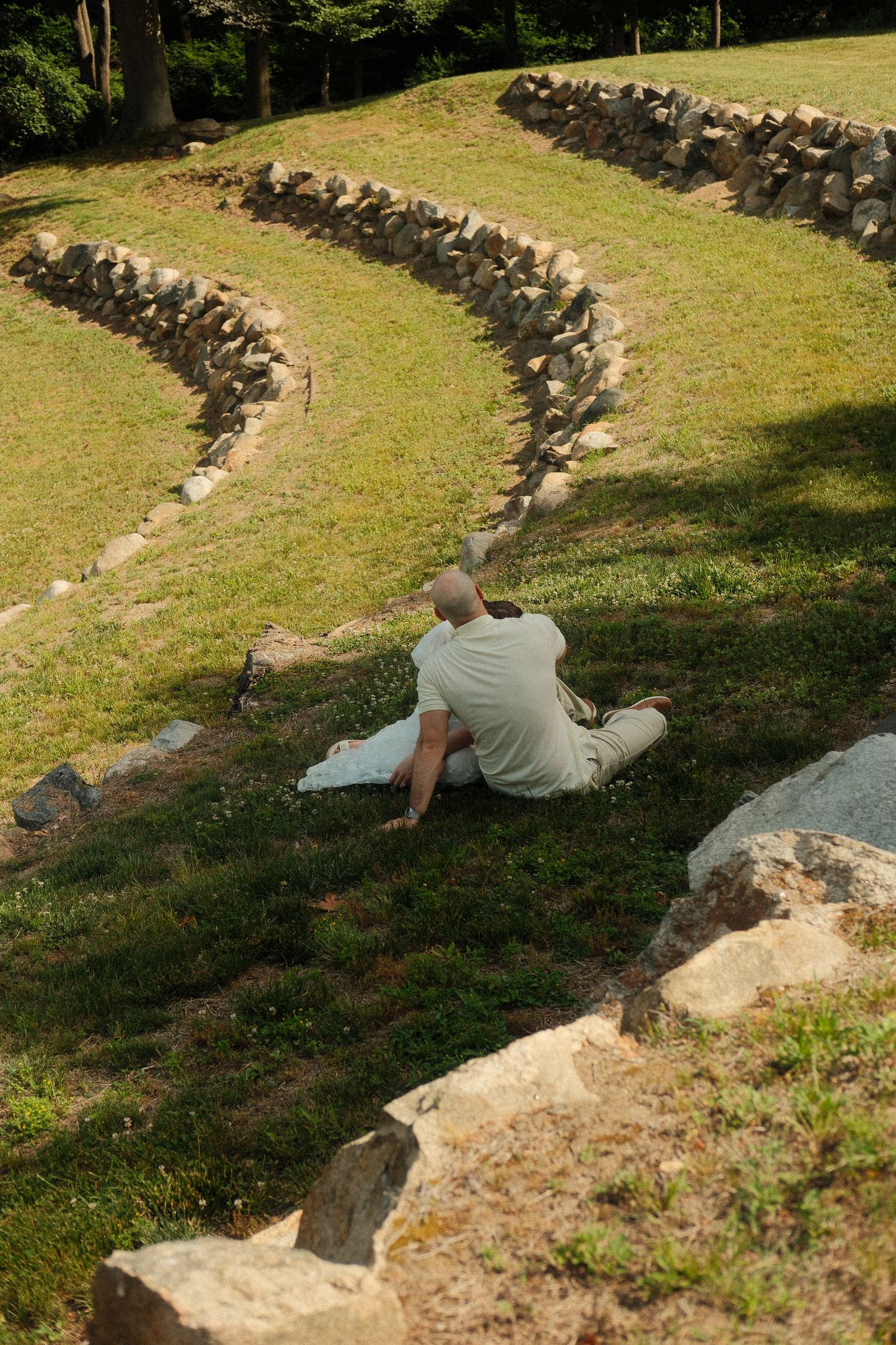 Couple sharing a quiet moment during an outdoor engagement photoshoot.