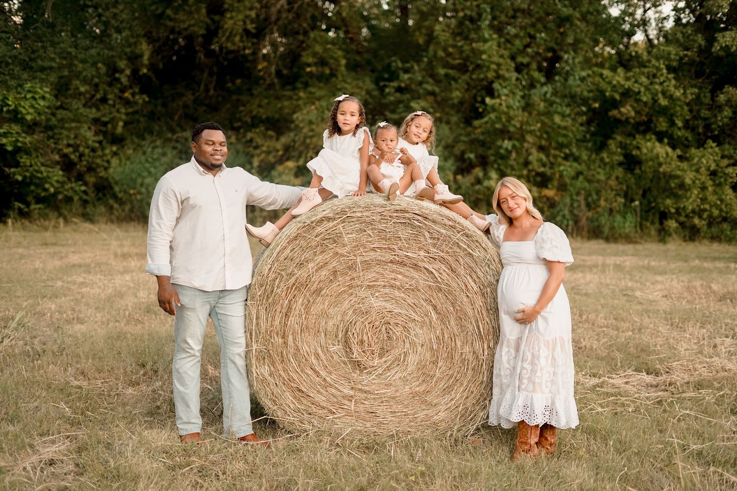 “Middle Tennessee luxury family maternity portrait with parents, children, and expecting mom in natural, elegant setting”