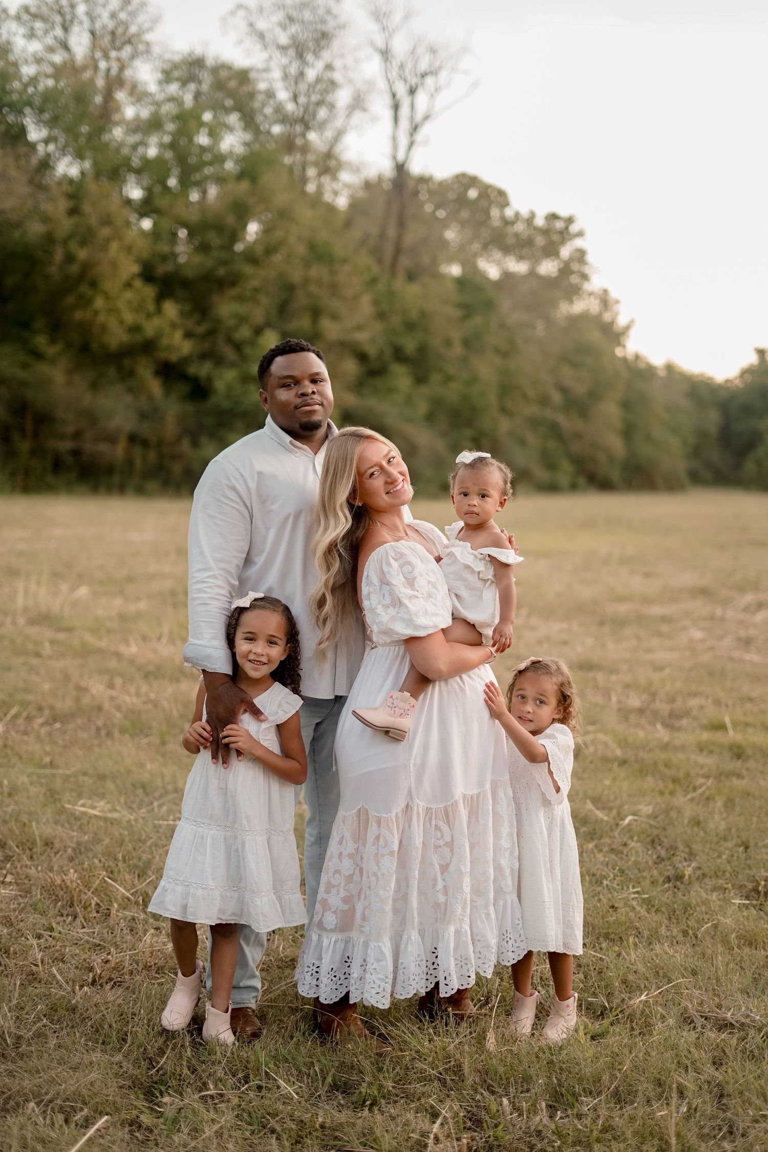 “Middle Tennessee luxury family maternity portrait with parents, children, and expecting mom in natural, elegant setting”
