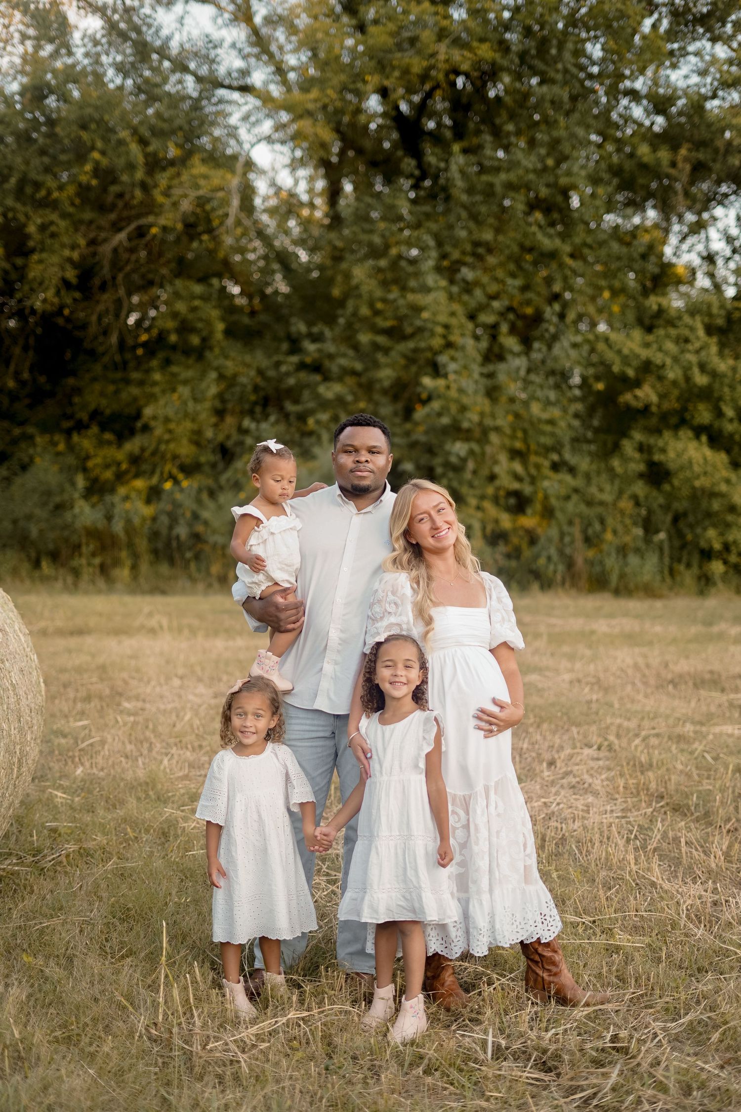 “Middle Tennessee luxury family maternity portrait with parents, children, and expecting mom in natural, elegant setting”