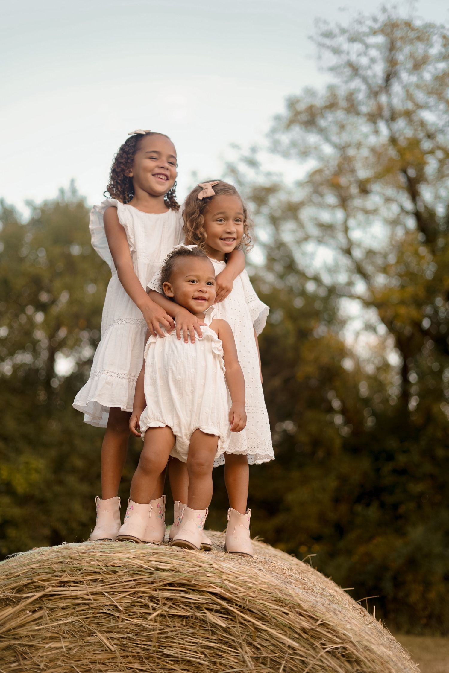 “Middle Tennessee luxury family maternity portrait with parents, children, and expecting mom in natural, elegant setting”