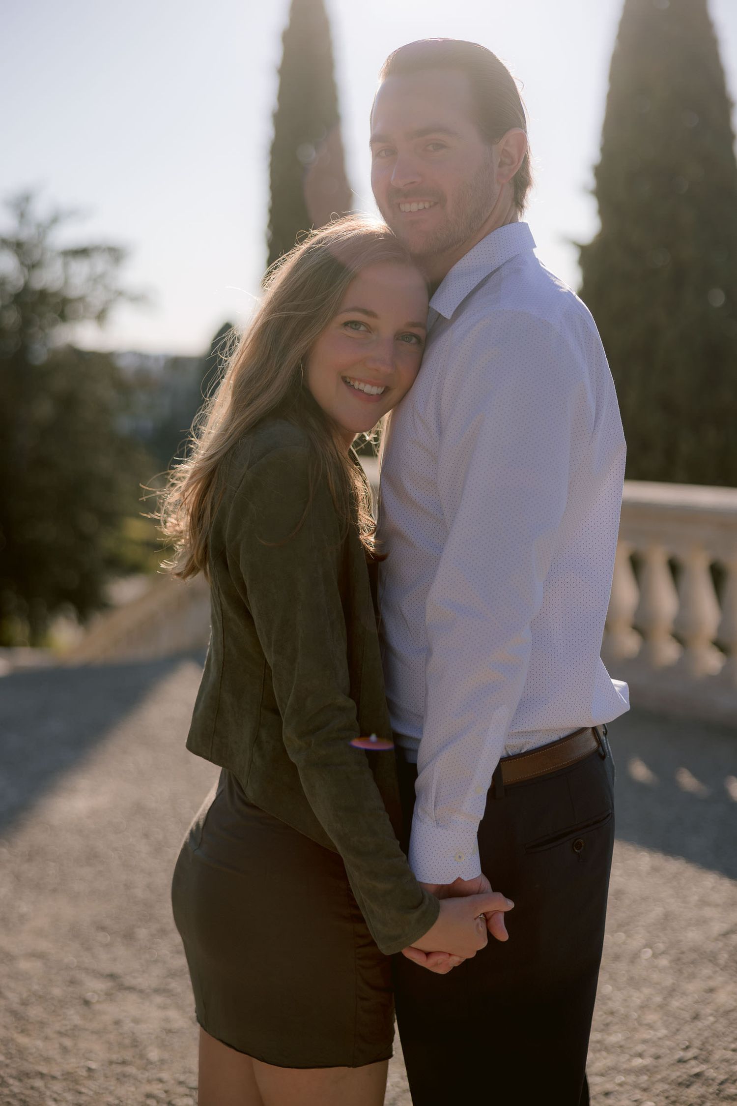 Couple sharing intimate moment during sunset photoshoot.