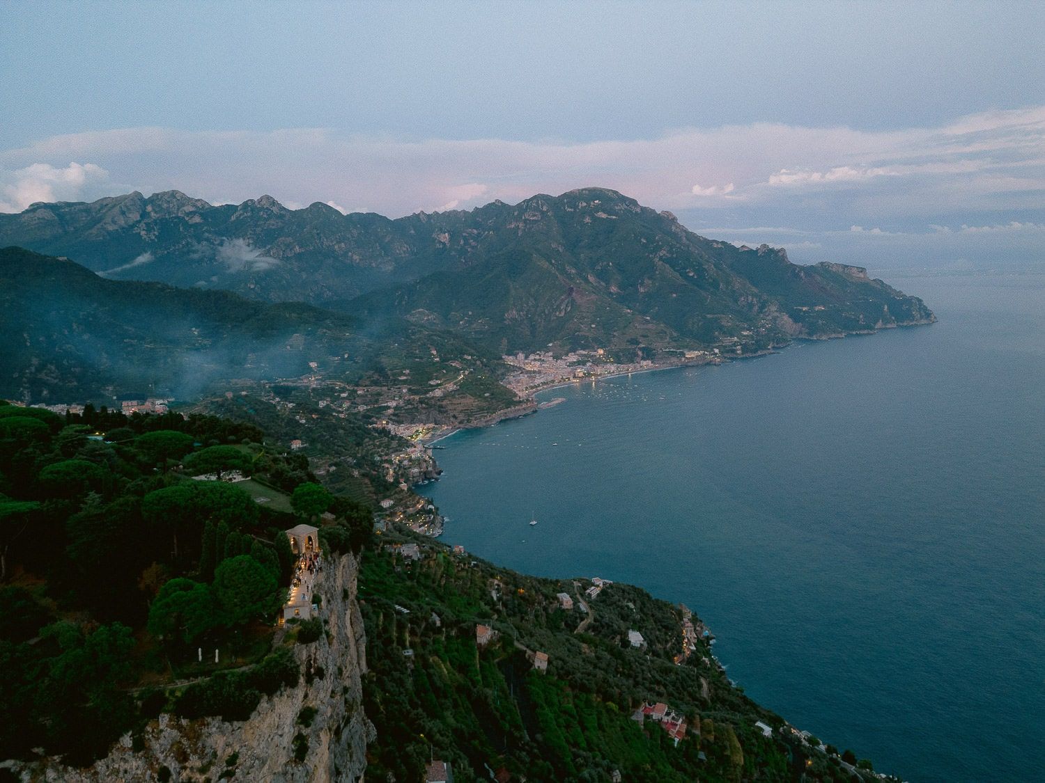 Dramatic coastal view of the Amalfi Coast with mountains meeting the Mediterranean Sea.