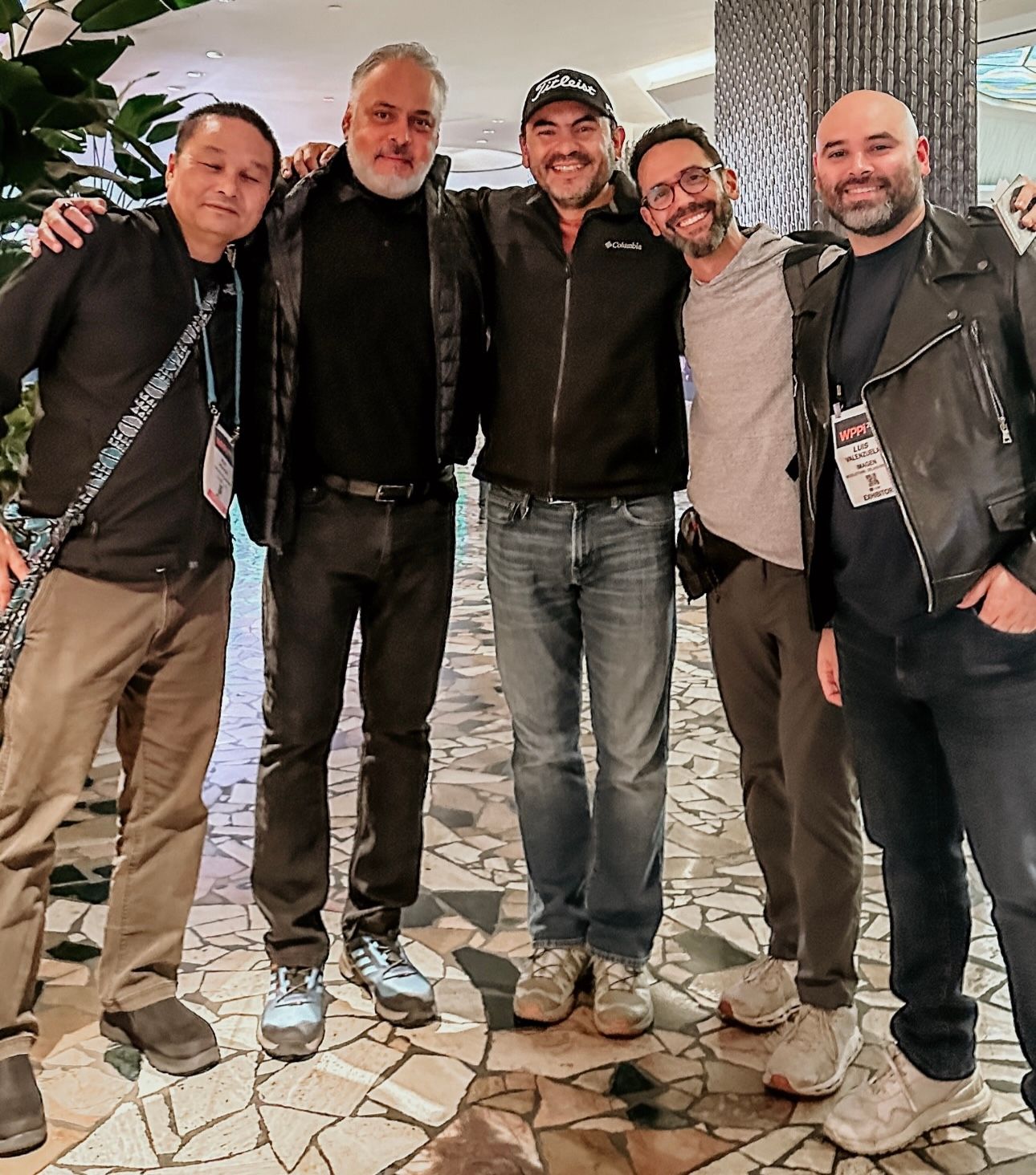 Group of photographers standing together at a professional event.