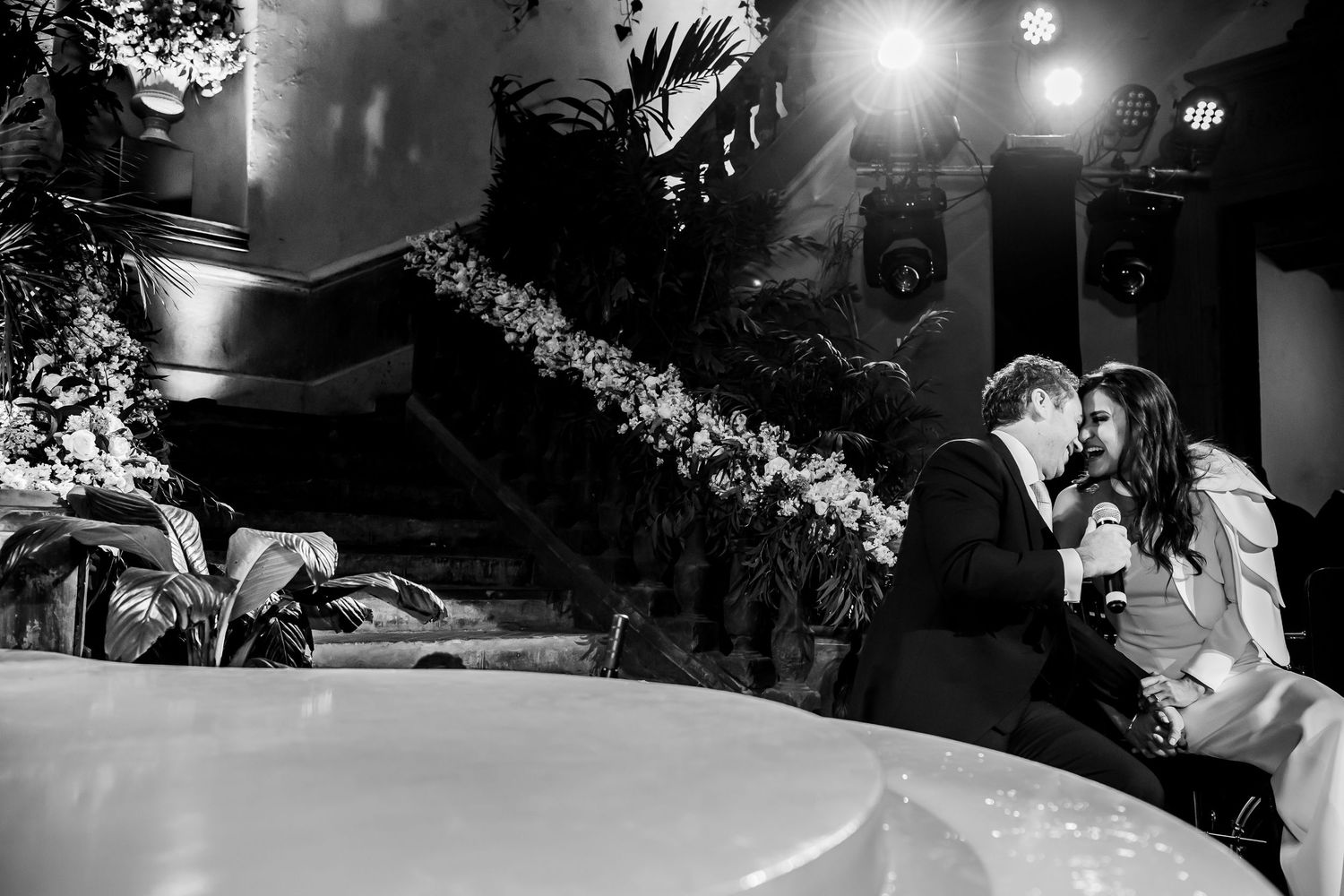 Romantic evening wedding moments captured in black and white photography.