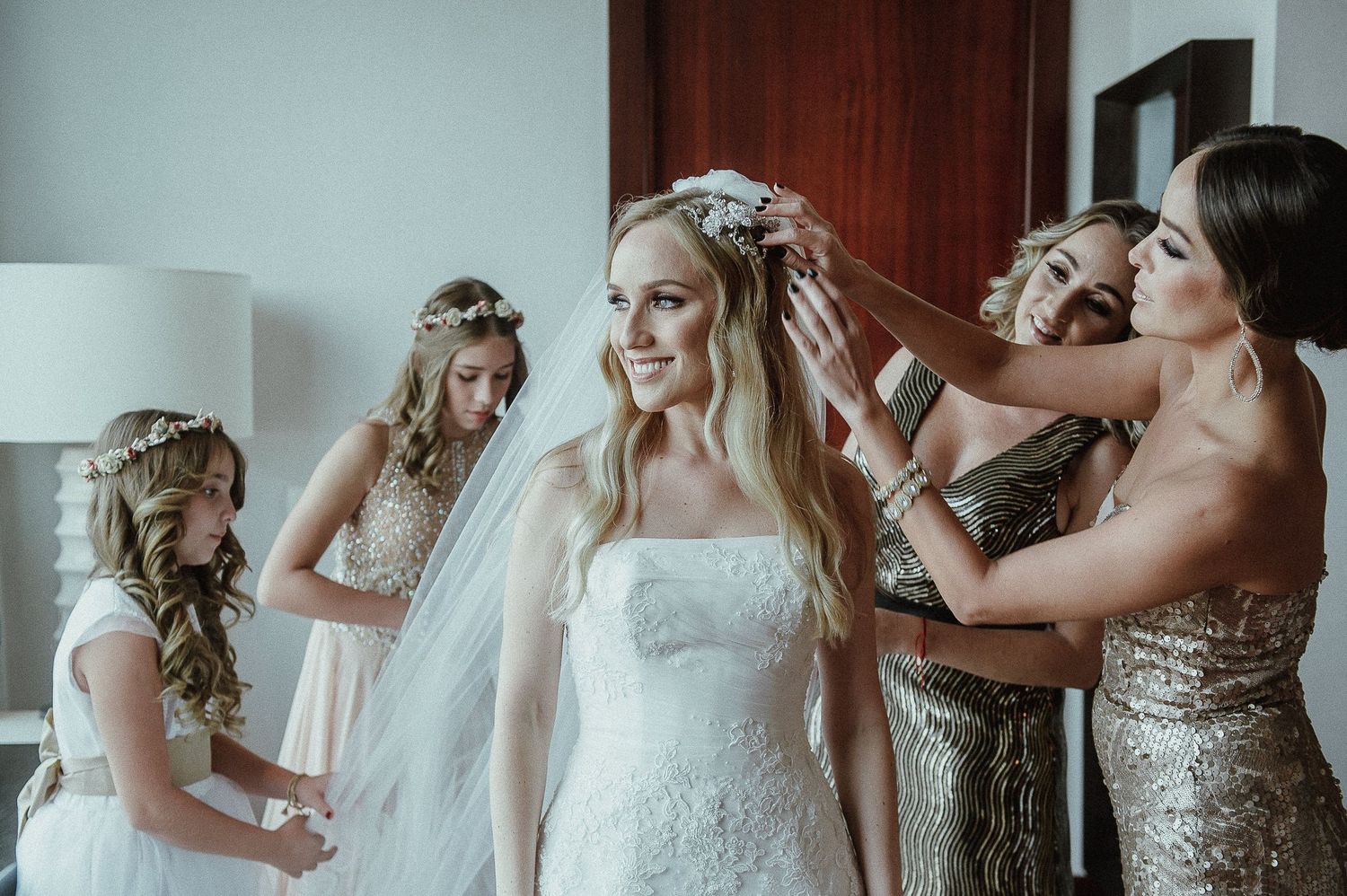 Wedding preparation scene showing dress and styling details in soft natural light.