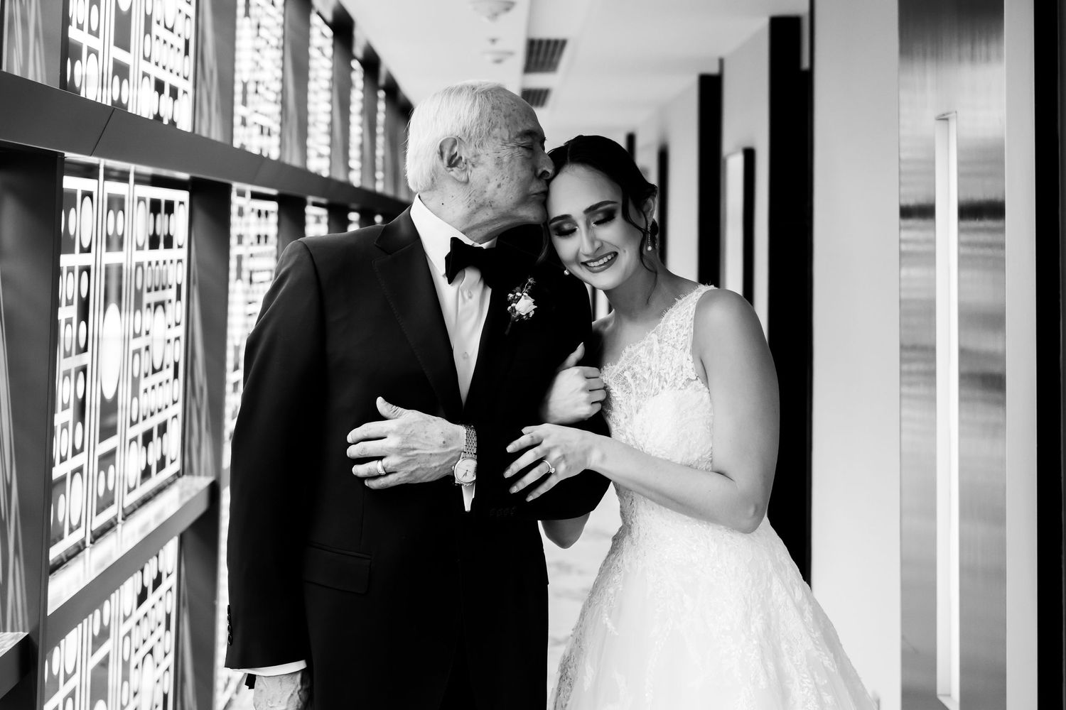 A black and white photo collage showing wedding moments in a bright hallway with elegant formal attire.