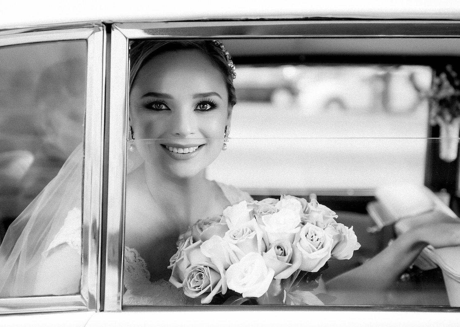 A black and white collage of wedding photos showing glimpses of a bride through car windows with roses and veils.