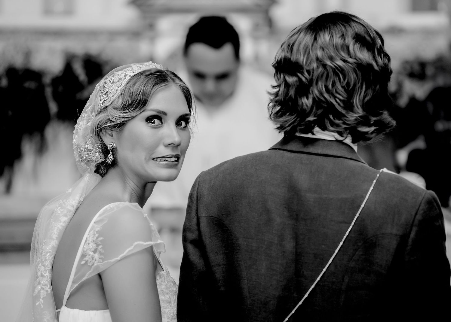 Series of romantic black and white wedding portraits capturing tender moments between the couple.