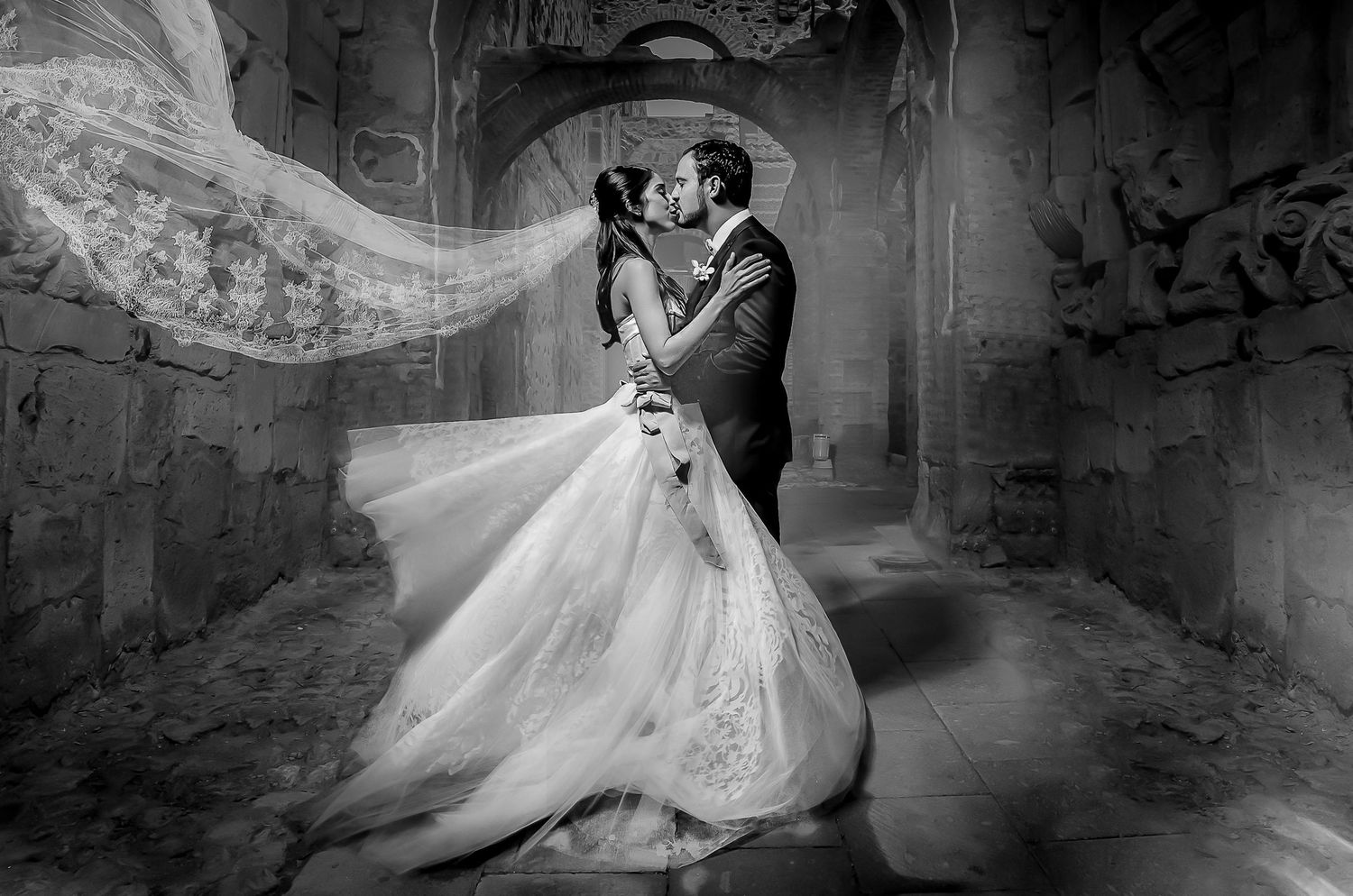 Series of romantic black and white wedding portraits in urban settings.