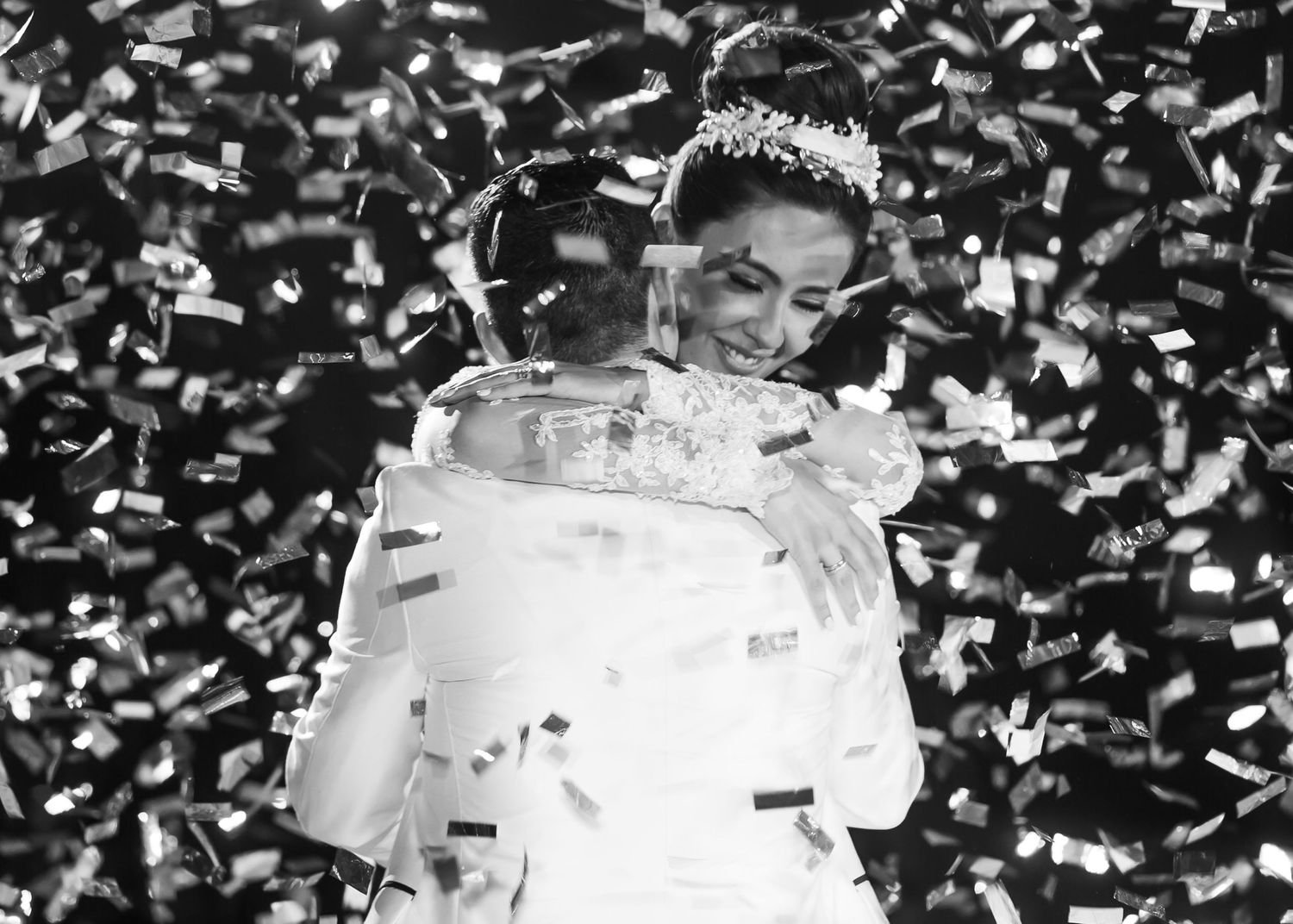 Black and white celebration with confetti shower during reception.