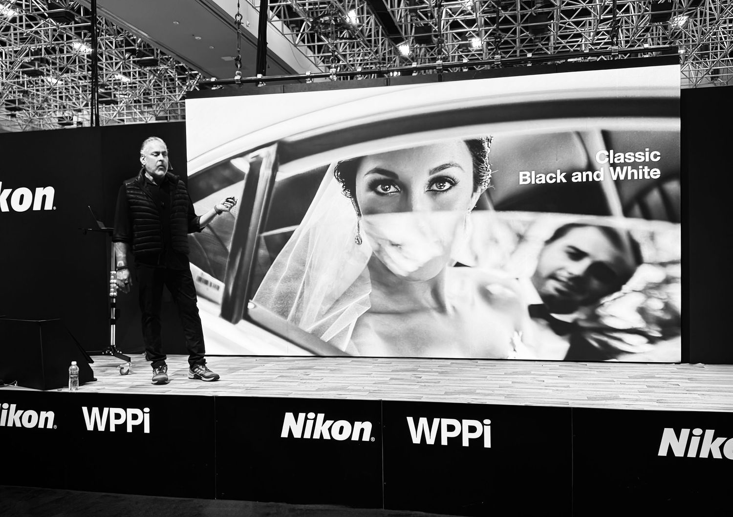 Exhibition hall with Nikon and WPPi branding displaying large format photography installations.