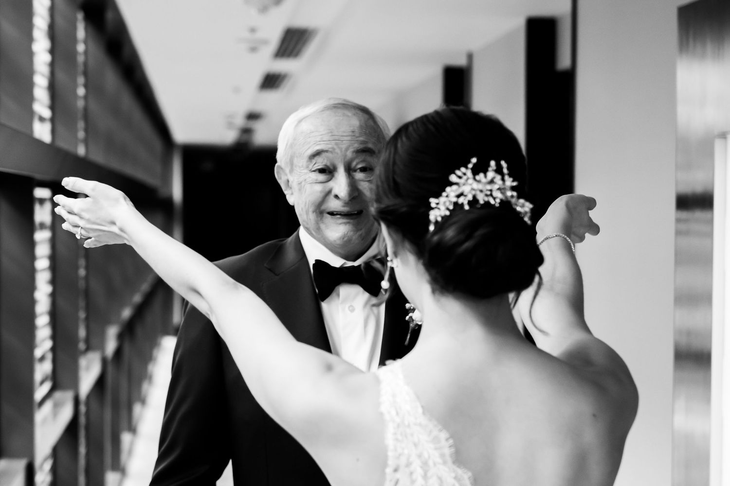 Black and white wedding photography sequence showing joyful dancing and celebration at a reception.