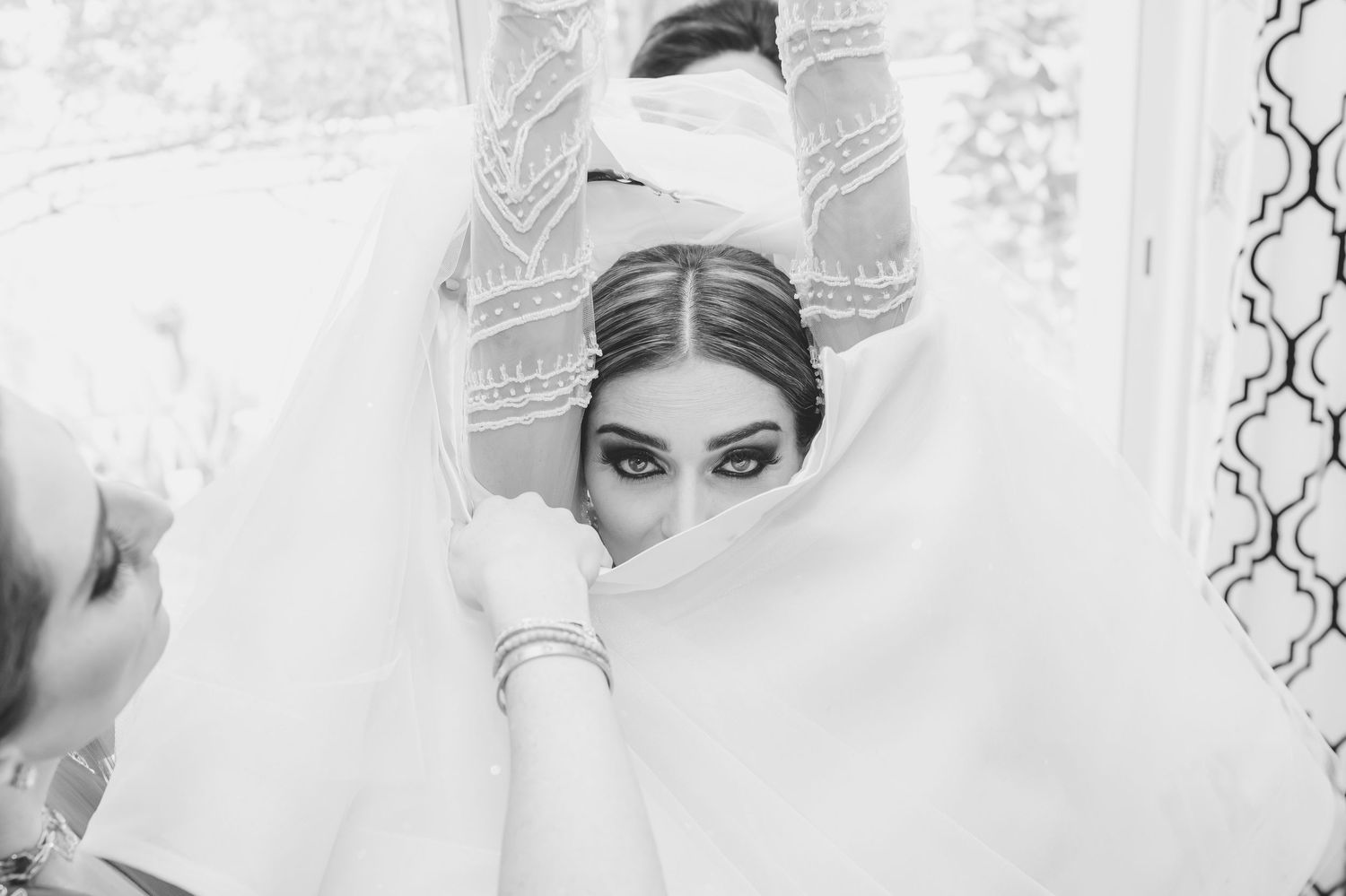 Black and white close-up shots of bridal preparation and styling.