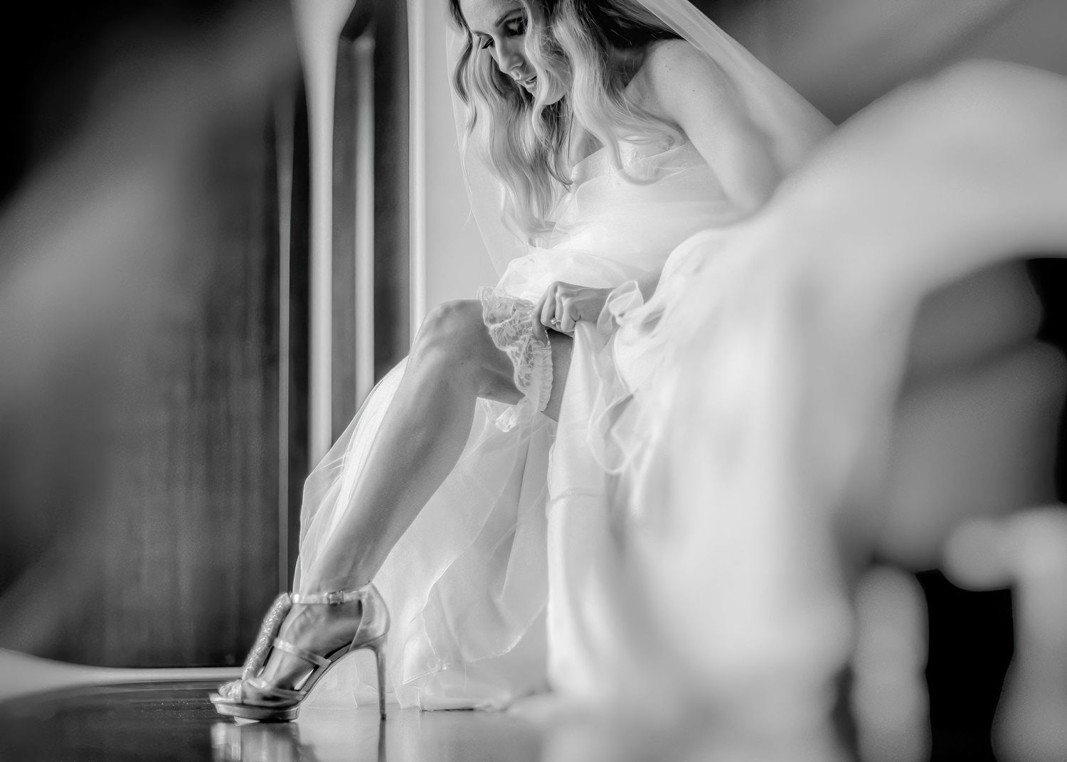 Artistic black and white photos capturing bridal preparation moments.