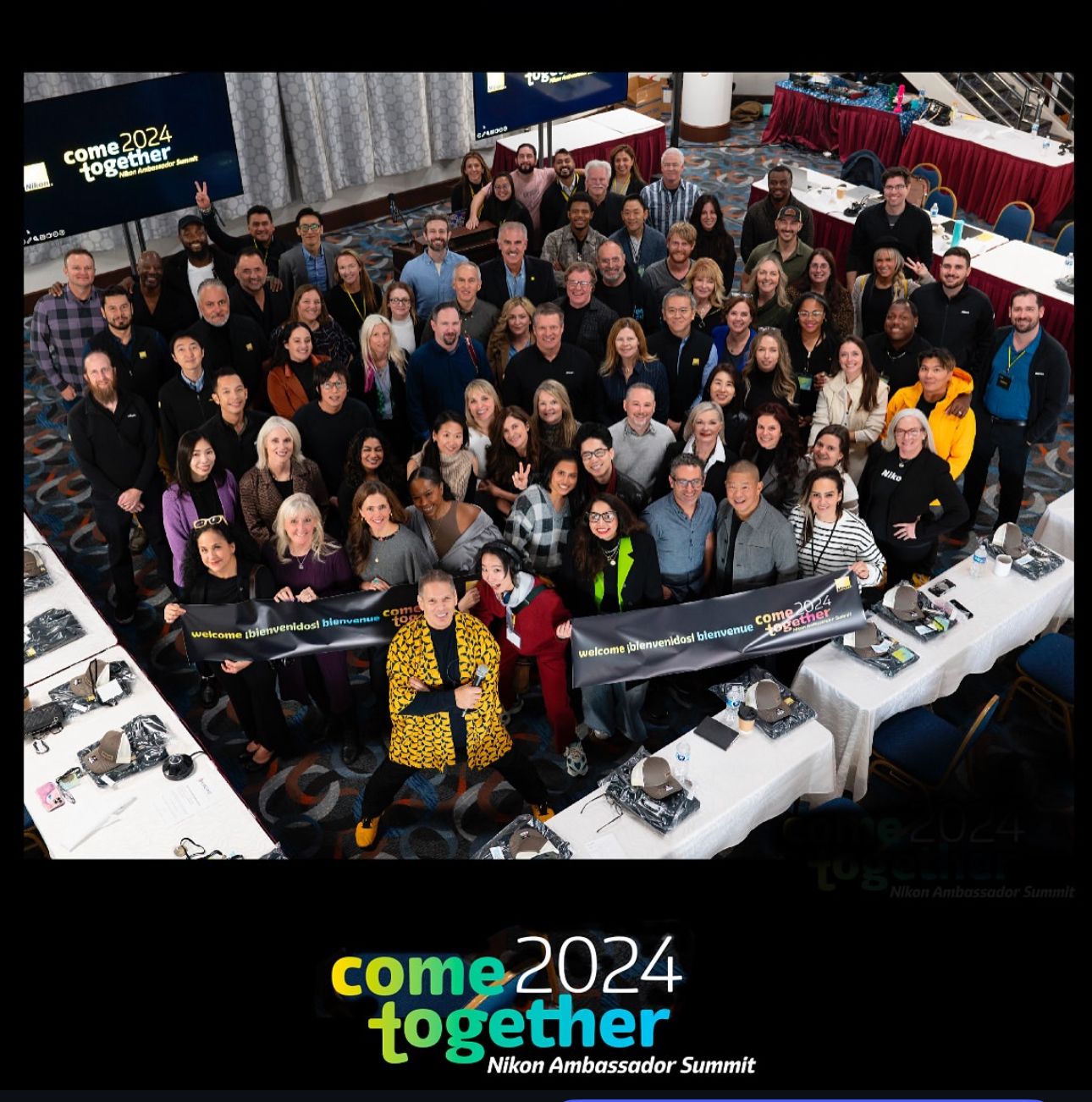 Large group photo of attendees at the Come 2024 photography summit.