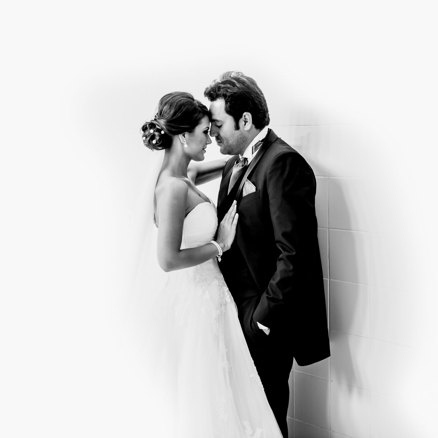 Black and white artistic wedding portraits showing intimate moments between newlyweds.