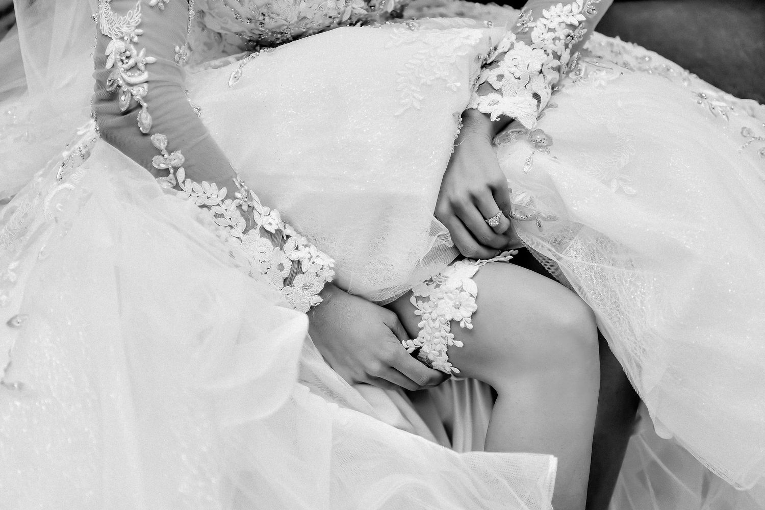 Black and white wedding photography series showing emotional moments during bridal preparations.