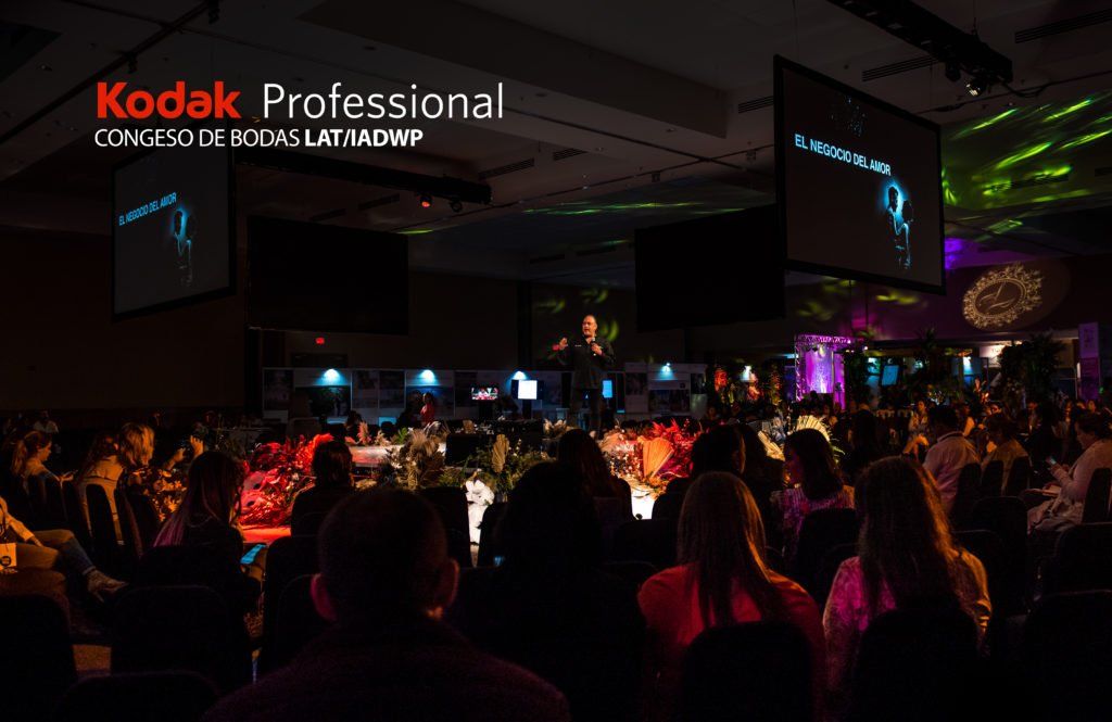 Kodak Professional logo displayed at a dimly lit conference venue.