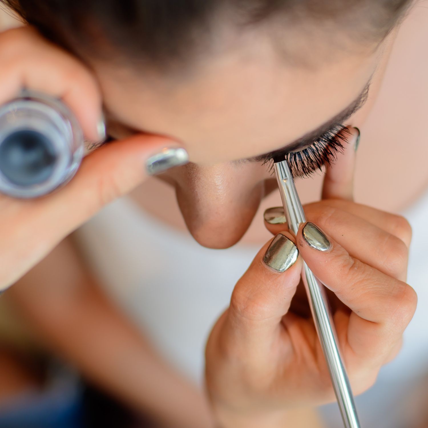 Close-up shots of makeup application with professional brushes and tools.