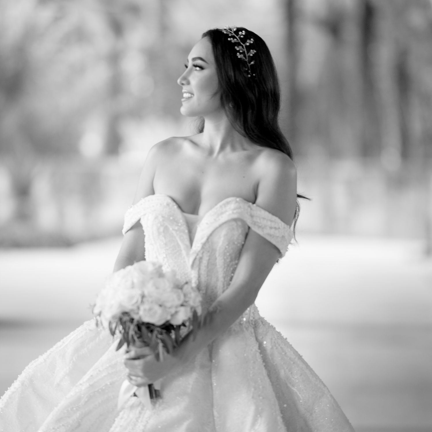 Black and white portrait showcasing the dramatic silhouette of a ballgown wedding dress.