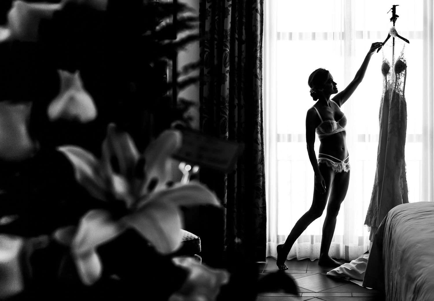 Artistic black and white silhouettes of dancing figures.