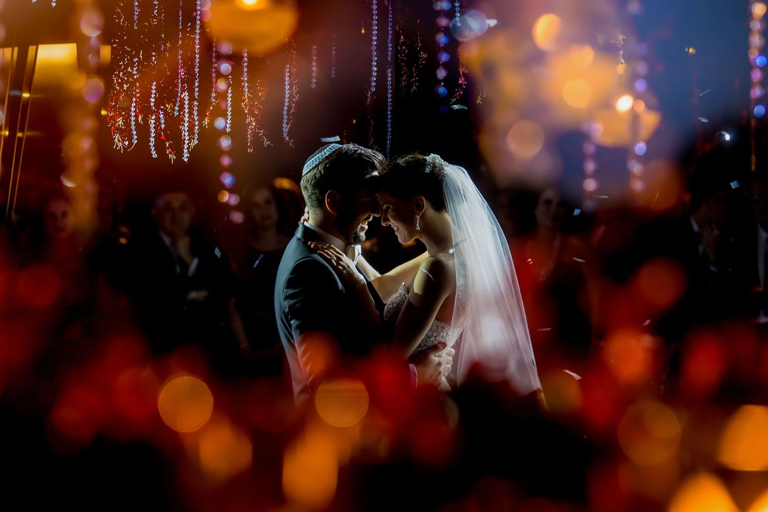 Romantic dance moment with soft bokeh lighting effects.