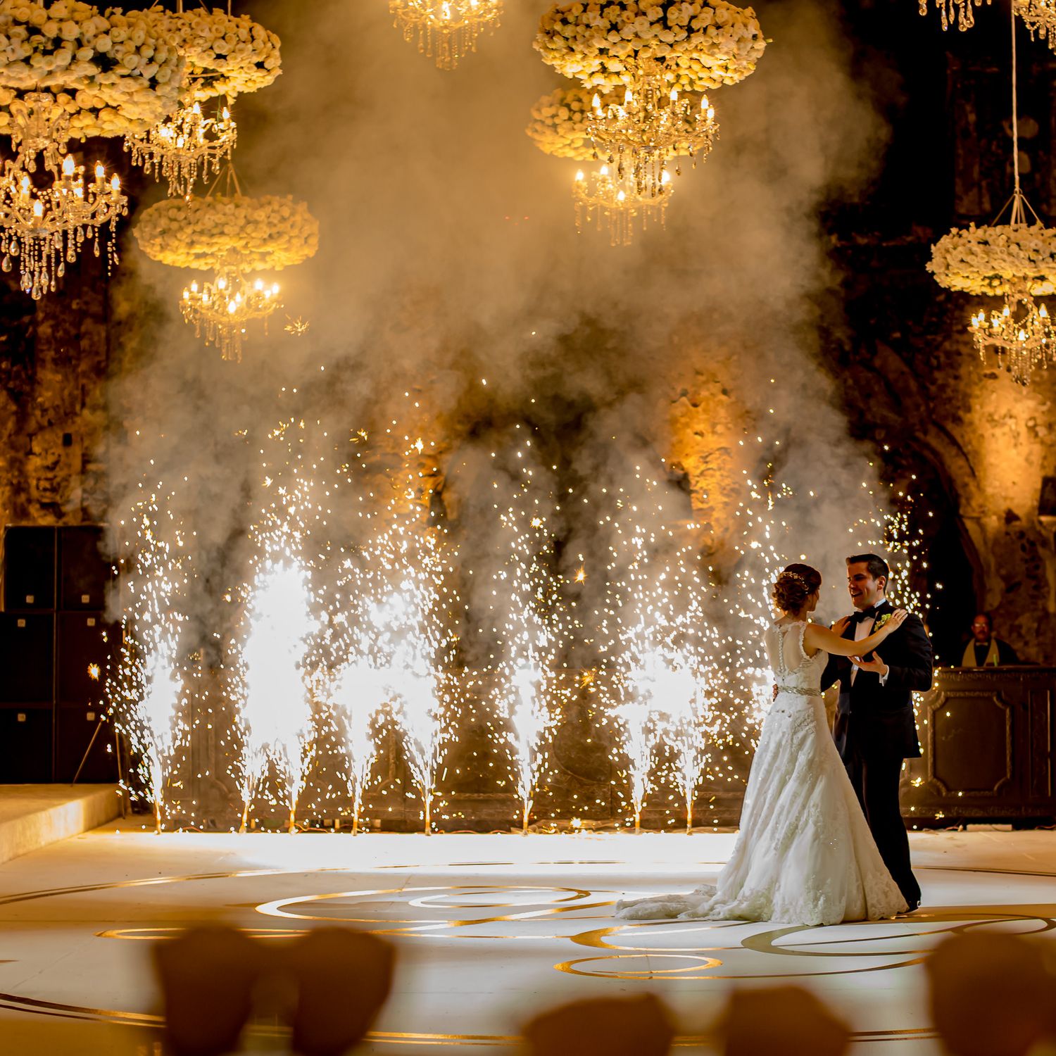 Wedding dance floor with dramatic sparkler fountain effects.