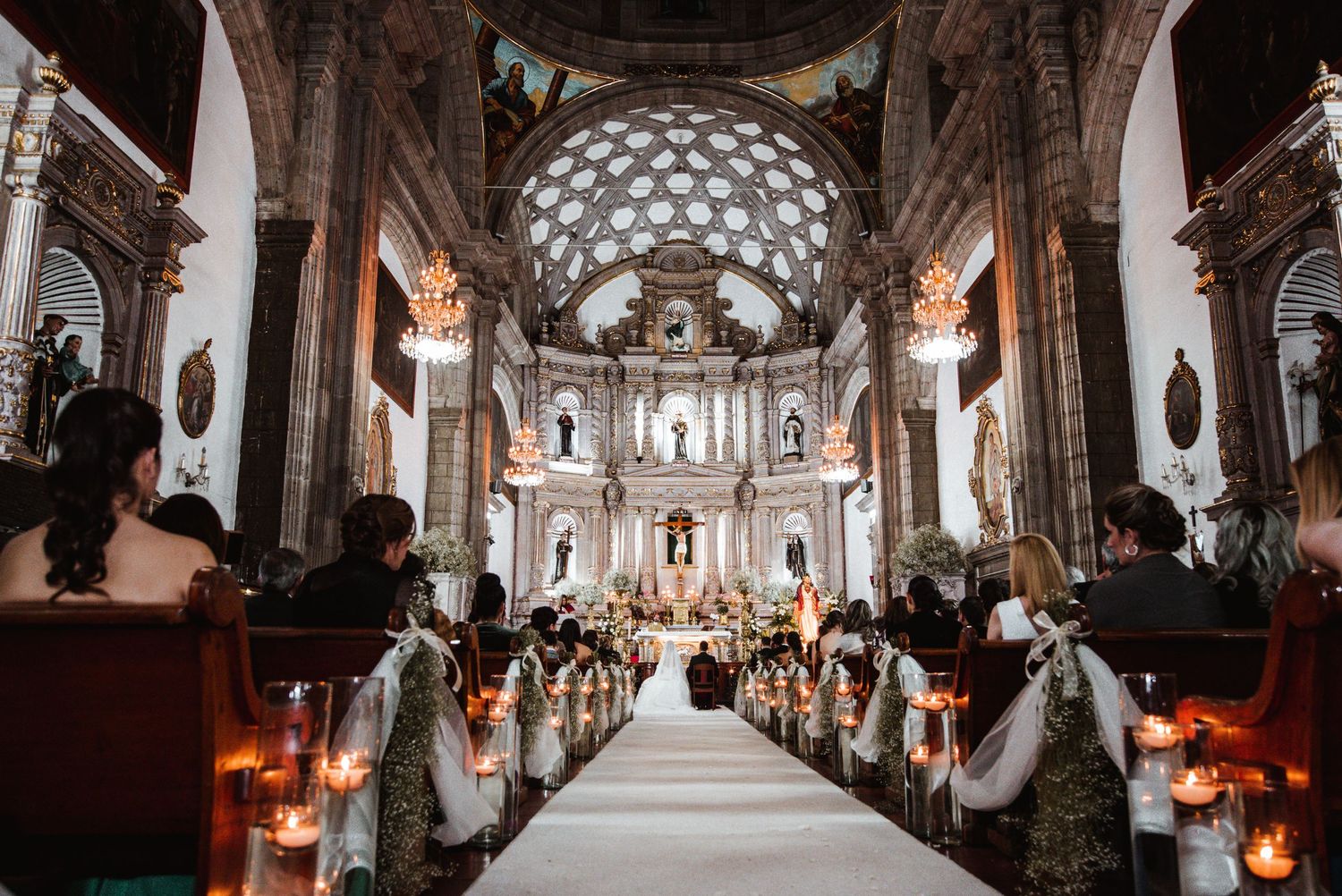 Wide angle view of a grand cathedral interior with vaulted ceilings and elegant columns.